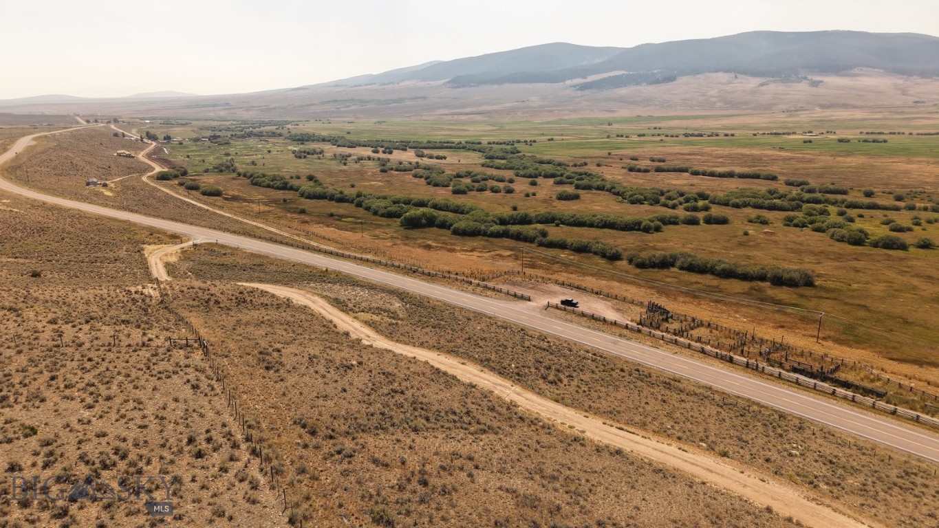 Nice buildable lot located right off the Scenic Byway in Polaris (west of Dillon) with easy 4 season access. This lot is an ideal building site - equipped with a 60 gallons-per-minute well already in place.  Land line telephone and fiber optic service is provided by Southern Montana Telephone;  T-Mobile tower and Starlink services also available.  
Spectacular panoramic views, with great year round hunting and outdoor activities.  Close to Crystal Park, Maverick Mountain Ski Hill, and Elkhorn Hot Springs.
Lot has been surveyed and perc tested by Anderson Engineering.  Property listing information deemed accurate;  however, buyers are encouraged to verify the accuracy of all details.