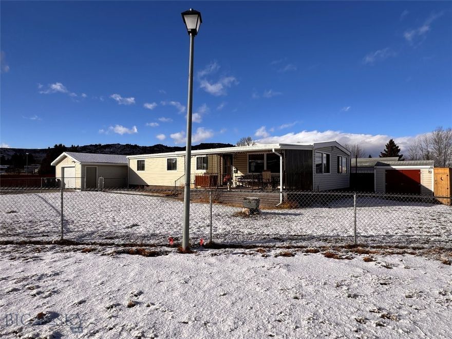 Turnkey home that's ready for you! Visit this charming home that's perfect for someone starting out, a delightful find for those downsizing, or a smart rental addition for savvy investors looking to deploy profits before the tax year ends. The generous corner lot, covered patio and fenced yard provide lots of space for outside activities and pets plus, the property includes a single-car garage and two small outbuildings, giving you plenty of storage for all your Montana gear. Cozy, convenient, and waiting for you—come see the potential!