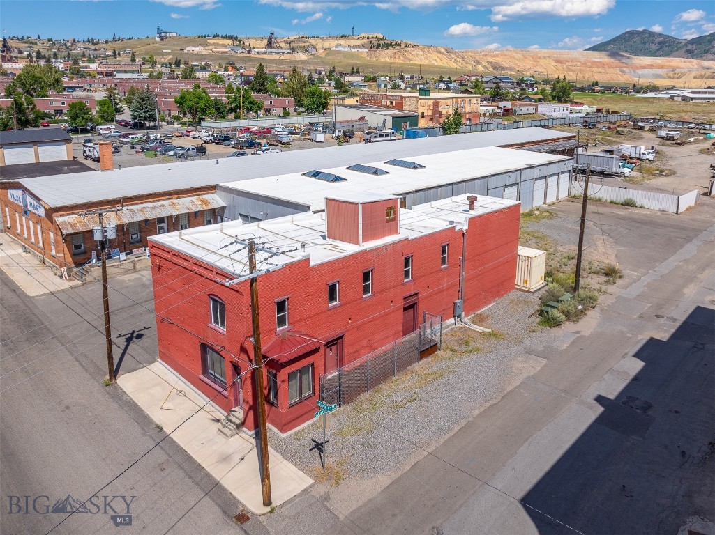 For Lease: Upper level of 648 South Arizona with a convenient and private entrance through the garage. The building is centrally located in the heart of uptown Butte. Also, offers a ton of potential with rich history and unique character. Per the industrial zoning, you'd need to be manufacturing and/or assembling something on-site to allow for retail use. The upstairs floor offers plenty of square footage, about 2,400 sqft. The beautiful natural light and incredible views on this floor are the highlight of the building. All floors supply 200 amps making even more versatility. The curb appeal and ample parking speak for themselves. Included above the garage is a deck area offering even more possibilities. Come check out this charismatic beauty.
