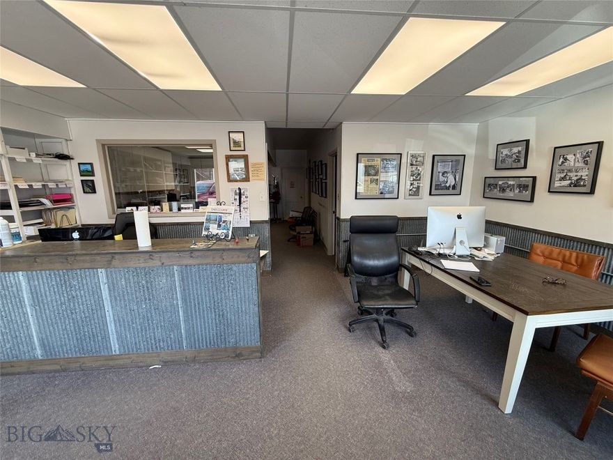 If location, location, location matters, you will not want to miss the opportunity to invest in this high profile building on the main street of rural Fairfield, Montana. It is currently being utilized as the headquarters for the local paper. Find a main reception area with good-looking metal wainscoting and a wall of built-in shelves, two offices, storage, a big flex room, a FULL bathroom with shower and tub and an oversized garage. Roof and some siding is metal. The floors are sturdy carpet and concrete. Fairfield is an incorporated city and this is in Zone 6. Many neighboring towns won't allow commercial properties to be used as residential, but Fairfield does, so take advantage of that and can convert to a home, or envision a mixed use scenario of business AND home or retain as business-only. With little lodging in town, consider a nightly rental. Built in 1964, the building is 2300'. The garage faces owned parking against an alley.