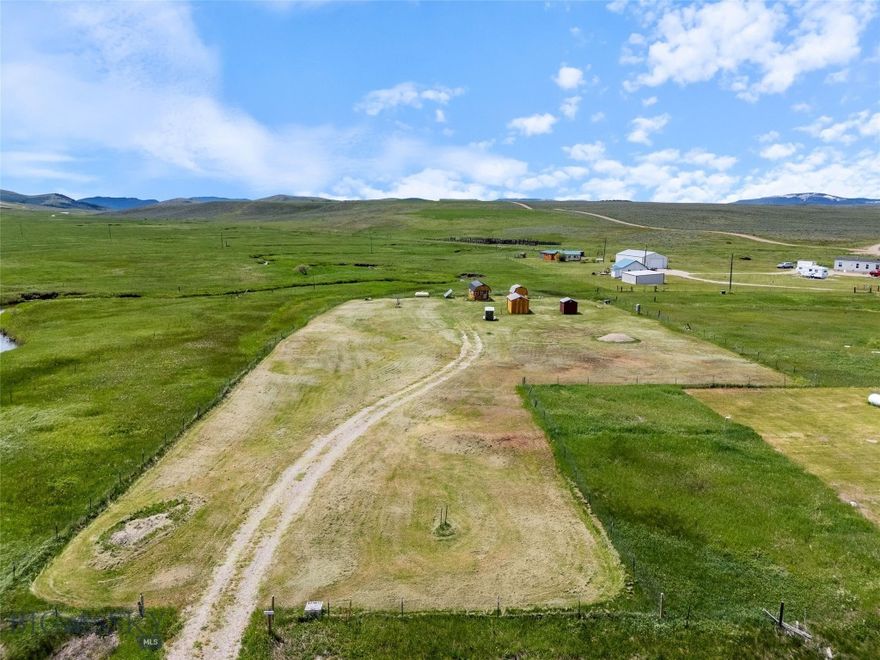 This unique 1+ acre parcel is located in the historic town of Ringling, Montana—a quiet, rural community steeped in history and surrounded by world-class outdoor recreation and expansive ranches. Originally named after John Ringling of the famous Ringling Brothers Circus, the town played a role in early Montana rail travel and tourism, serving as a stop along the now-defunct White Sulphur Springs and Yellowstone Park Railway.

Perfectly positioned in the heart of Big Sky Country, this property is a gateway to big game hunting, fishing, hiking, and skiing. Both Bridger Bowl and Showdown Ski Area are within an hour’s drive, offering year-round adventure.

The parcel features two off-grid cabins: one measuring 12' x 28' and the other 10' x 20', each equipped with propane heat and powered by solar energy. The existing solar system includes eight 24-volt zero-emission batteries and is designed to support up to four additional cabins of similar size. There is an additional 10' x 12' storage barn and 8' x 10' shed.

400 amp power service, telephone, and internet access are located at the corner of the property, offering the convenience of modern connectivity.

Whether you're looking for a recreational getaway, a hunting basecamp, a future homesite, or a peaceful retreat, this Ringling property offers a rare blend of solitude and history in one of Montana's most scenic regions.