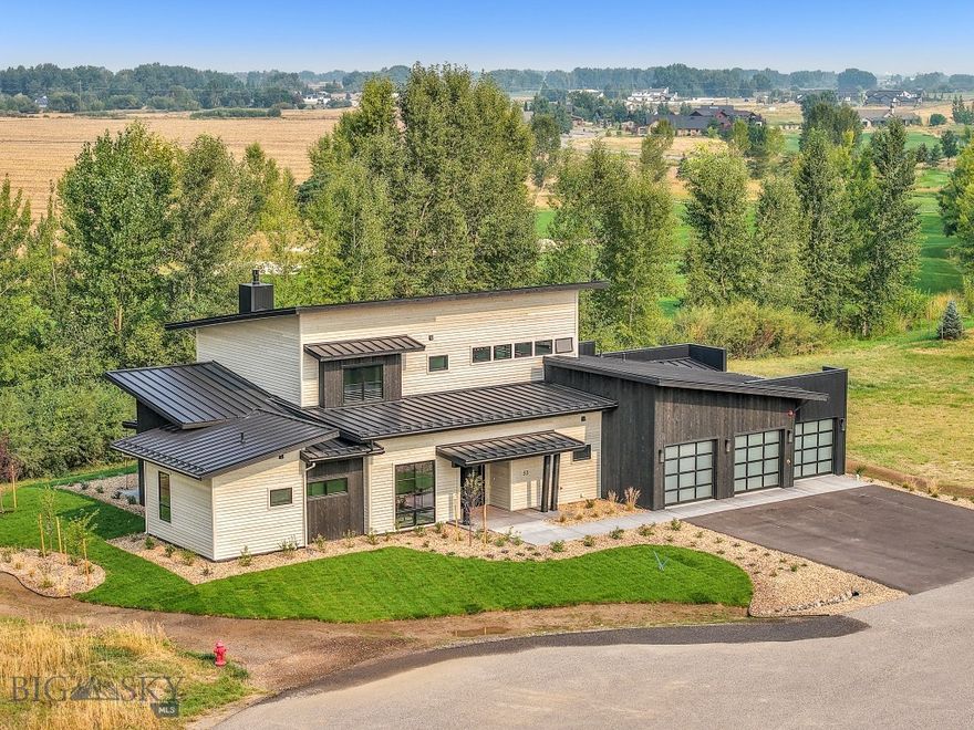 Welcome to this stunning, newly constructed two-story home located in the prestigious Black Bull community, backing up to the serene golf course. This property is a true masterpiece, blending modern luxury with thoughtful design. As you enter, you’ll be immediately captivated by the exquisite details, including beautiful hardwood floors, custom beams, built-in shelving, and a sleek custom fireplace. These elements come together to create a warm and inviting living area that effortlessly flows into the heart of the home—an impeccable kitchen that’s a chef’s and entertainer's dream. Equipped with top-of-the-line stainless steel Thermador appliances, expansive cabinetry, and a spacious pantry, this kitchen offers both style and practicality. The island serves as a statement piece, showcasing a stunning granite countertop, bar seating, and additional cabinets for extra storage. Natural light floods the home through Anderson 400 series windows, enhancing the open, airy feel of each room and offering breathtaking views of the surrounding landscape from one of the most coveted lots in the private community. On the main floor, the luxurious master suite provides ultimate comfort with private patio access and a designated hot tub location, perfect for relaxation. The spa-like master bath features heated floors, a stunning tile shower, a standalone soaking tub, and dual vanities for added convenience. The large walk-in closet includes built-in shelving, providing generous space for all your wardrobe needs. Also on the main level, you’ll find a guest bedroom, a stylish half bath, and a laundry room complete with a utility sink, and an incredible entry closet with additional drop zone opportunities for every weather condition Montana throws at you. Upstairs, provides flexible space for entertainment. The master bedrooms, with their own luxurious full bathrooms, offer the same high-end finishes as the rest of the home, including custom cabinetry and beautiful countertops. Step outside to the deck off the second-floor living area, where you’ll enjoy panoramic views of meadows, farmland, golf course, and a peaceful stream—an ideal setting for relaxation or outdoor gatherings. This home also offers separate heating and cooling zones for each level, with ceiling fans in every room for added comfort. The attached 3-car garage is heated, includes a convenient drain, and offers ample space for storage and organization. (PHOTOS VIRTUALLY STAGED)