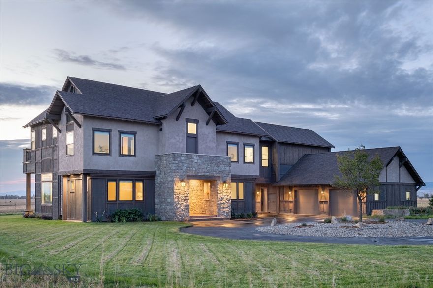 Welcome to 259 Prairie Glen, a masterpiece of custom craftsmanship nestled within the prestigious Spain Bridge Meadows. This 5,398-square-foot estate combines timeless elegance with high-end modern utility, all set against a backdrop of mesmerizing mountain views on 1.5 sprawling acres. The journey begins at the entryway, where a breathtaking circular staircase sets a tone of refined luxury. Throughout the home, gorgeous wood floors and decorative tile work lead you through an open-concept layout designed for seamless indoor-outdoor living. The expansive master suite serves as a private sanctuary, while three additional bedrooms provide ample space for family or guests. The heart of the home is a gourmet kitchen that balances style and high performance. It features a 36" gas cooktop, 64" professional refrigerator/freezer, and a discreetly paneled dual-drawer dishwasher along with custom cabinetry, upgraded stainless steel accents, and a charming breakfast nook for casual mornings. Beyond the aesthetics, this home is engineered for ultimate comfort and efficiency. Equipped with an April Aire steam humidifier, an April Aire 5000 electronic air cleaner, dual 50-gallon tanks with an instant hot water re-circulation system, and a soft water bypass. Car enthusiasts and adventurers will appreciate the oversized 1,035 SF garage, providing ample space for Montana "toys" and storage. Enjoy the serenity of wide-open spaces and mountain vistas while remaining just moments away from the vibrant energy of downtown Bozeman. This is more than just a house; it’s a dream property in a class of its own.