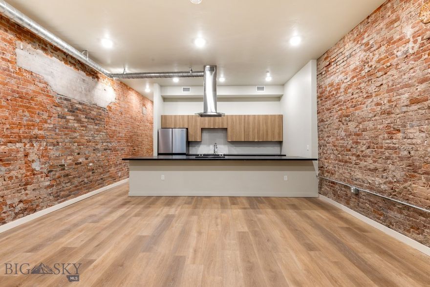 Experience modern living in historic Uptown Butte at Rudolph Condos, Butte's newest condominium development. This 1-bedroom, 1-bathroom condo features an open floor plan and exposed brick. The stylish kitchen boasts stainless steel appliances, while the spacious living area is perfect for entertaining. Located in the heart of Uptown Butte, you’ll enjoy easy access to dining, shopping, and local attractions. Don’t miss this rare opportunity to own a contemporary condo in a vibrant, historic setting!