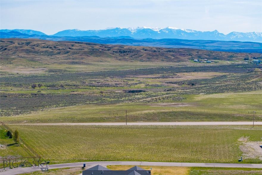 Welcome to Wheatland Meadows, a peaceful community nestled in the scenic rolling hills just off Highway 287. This level 2.16-acre parcel is ideally positioned near the front of the subdivision, offering a sense of privacy with elevated views that shield it from direct road visibility. Enjoy expansive mountain views from this quiet loop, where the generous lot size enhances the spacious, open feel. Power is already available at the lot line, and the neighborhood features paved roads, well-maintained parks, and flexible covenants—including the option to build a shop—perfect for storing all your tools, toys, and outdoor gear. With quick access to I-90, Bozeman is just a short drive away. Don’t miss your chance to build your dream home in this ideal Montana setting!