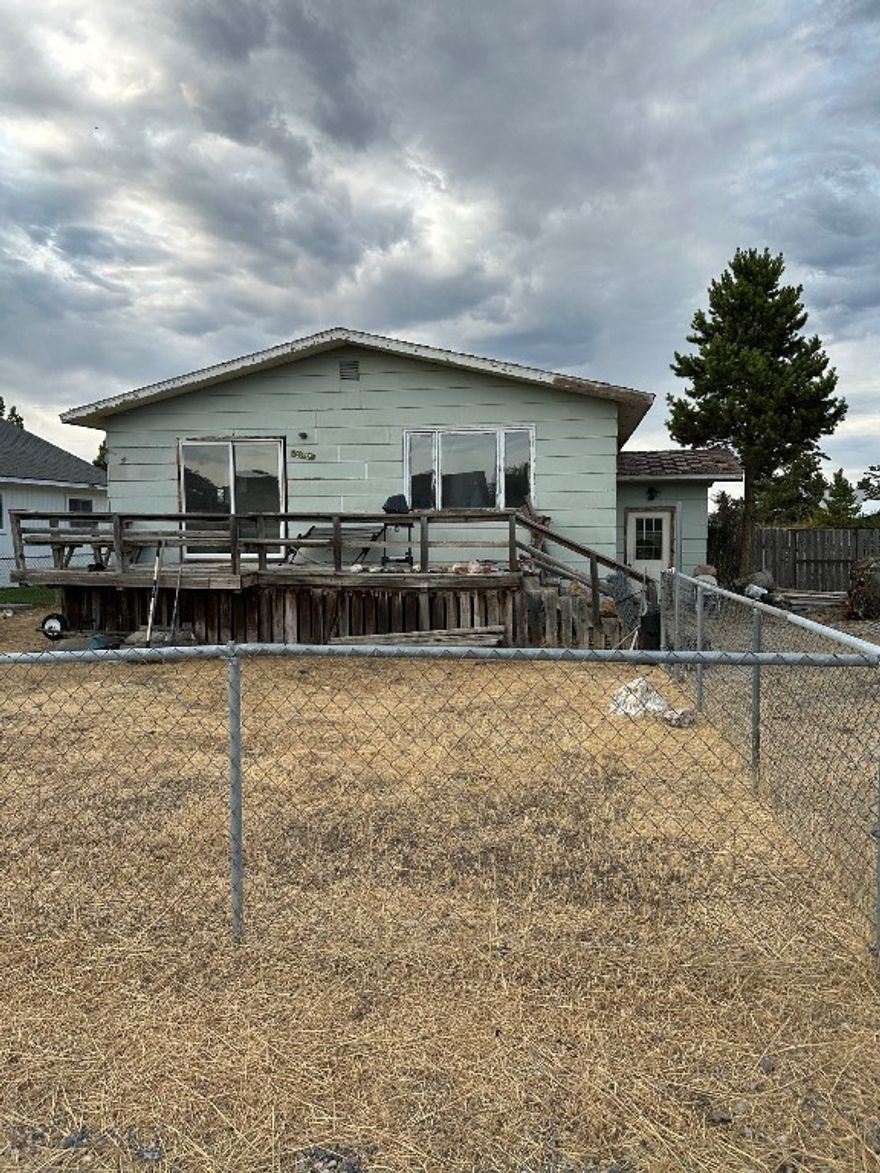 WELCOME TO THE CHARMING COMMUNITY OF ENNIS, MONTANA! This spacious fixer-upper would be perfect for a family wanting to design their own interior, OR local business in need of housing staff, OR INVESTMENT OPPORTUNITY as a great rental property... many, many possibilities with this ENNIS split-level home on an 8800+ sq ft lot. Upstairs you'll find kitchen, dining and living space + 2 bedrooms and full bathroom. Downstairs includes large living area, laundry room, 3/4 bathroom and 2 rooms that can be made into bedrooms by adding closets and egress windows. Alley access provides MORE opportunity to build rear garage + ADU for further rental income. Take advantage of this investment opportunity in the growing town of Ennis, bursting with character and charm!