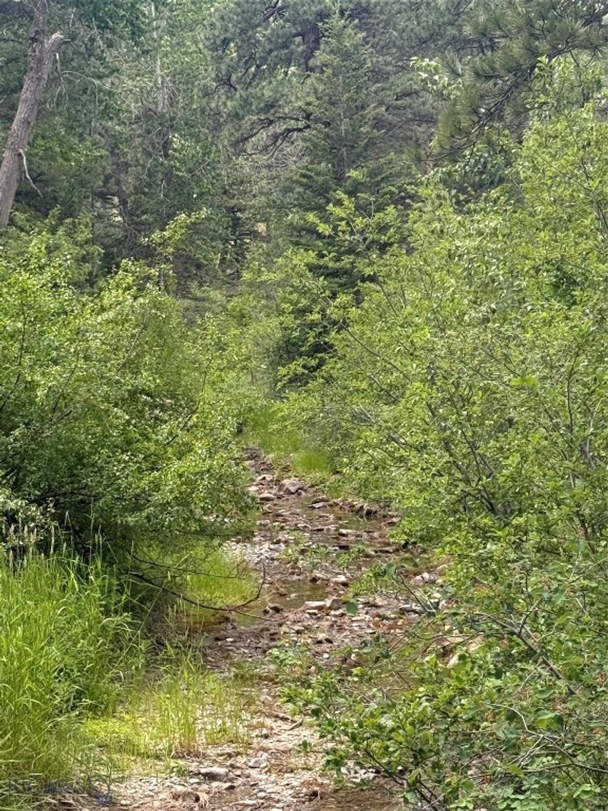 Conveniently located between Helena and Great Falls, this is the perfect recreational property to enjoy the great outdoors! This 12 acre property has Little Wolf Creek flowing through it, it borders State Lands, and is just a few short miles to the blue ribbon fishing of the Missouri River. This off-grid parcel has year-round access, as the County road enables you to enjoy all seasons. There is a shed and small bunkhouse in place, so you can start enjoying the property immediately. Hunt, fish, hike, camp or anything you want to do that is nature related. This is your oasis!