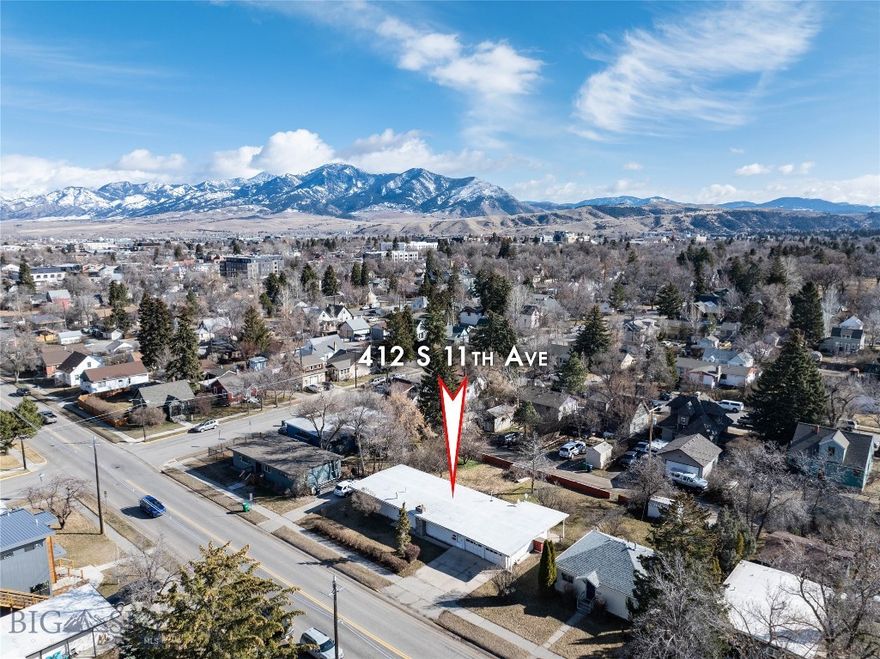 A prime opportunity to design and execute your development vision in desirable downtown Bozeman. A rare redevelopment opportunity, this unique property includes four city lots and 100’ of frontage on S 11th. The lots together total 11,900 sq ft and are located just blocks from MSU, Coop, Cooper Park, shopping, services and amenities. According to city online maps, this property is zoned RA which allows for a multitude of new build options. Structure on property is not in habitable condition and is sold  ‘as is’.  Located just three blocks from MSU, these parcels feature both roadway and alley access. Water, sewer, gas and power are to the property. Property lathes are estimated corner locations set by a surveyor – pins are not set. Buyer to verify all information and potential current and future uses independently and to their own satisfaction.