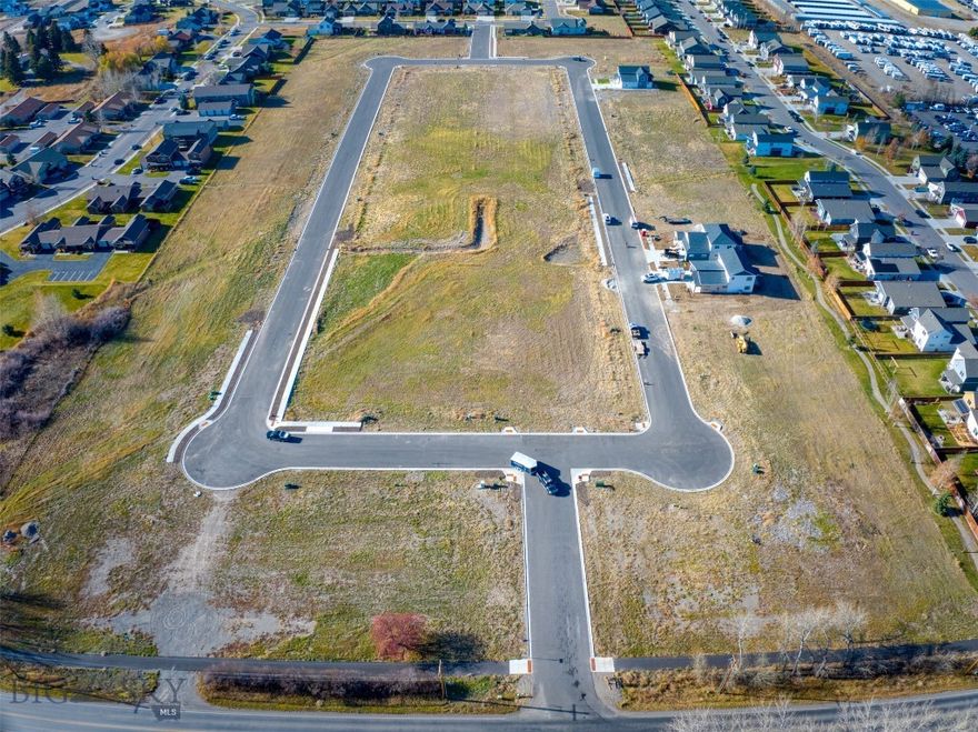 New single-family subdivision lots ready to build. Woodbury Grove Subdivision combines the beauty of Montana's rural landscape with the convenience of living just minutes from everything Bozeman has to offer. This subdivision offers wide streets and sidewalks creating a neighborhood feel rarely found outside Bozeman city limits. A Master Plan designed to create multiple living options from single family homes to townhouse lots and a few condo units will create an intimate community for every home as the development grows. Traditional architecture, responsible design, quiet streets, and more make Woodbury Grove perfect for families with children to build a community together over time. Located on the west side of Bozeman, 10 minutes from downtown or 10 minutes to the Gallatin River.