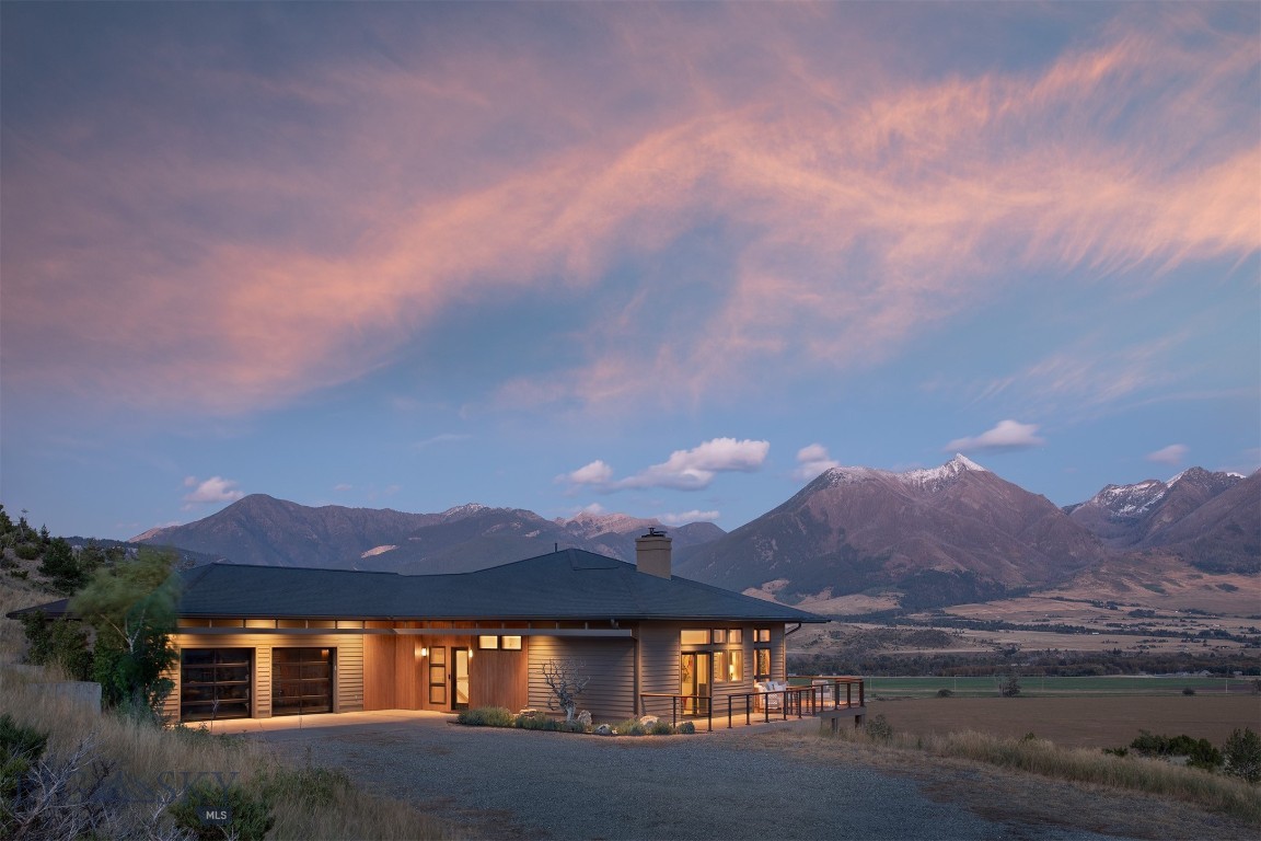 Nestled on 160 unspoiled community acres, and minutes from the Yellowstone River, this 4-bedroom/3.5 bathroom
retreat is your private oasis steeped in views of Montana's legendary Paradise Valley. 3,929 sq. ft. of thoughtful layout imbue luxury with reverence to this world-class setting. Elegant custom finishes throughout, each bedroom is located on a corner, affording unobstructed panoramic views of the breathtaking Absaroka Mountain Range and the valley below. Double primary suites, chef's kitchen and an 850 sq. ft. Ipé deck on the main level, with two guest rooms, bar movie and yoga rooms and a surrounding patio with hot tub on the lower level. This is an incredibly special property that will leave you in awe. Schedule your showing today!