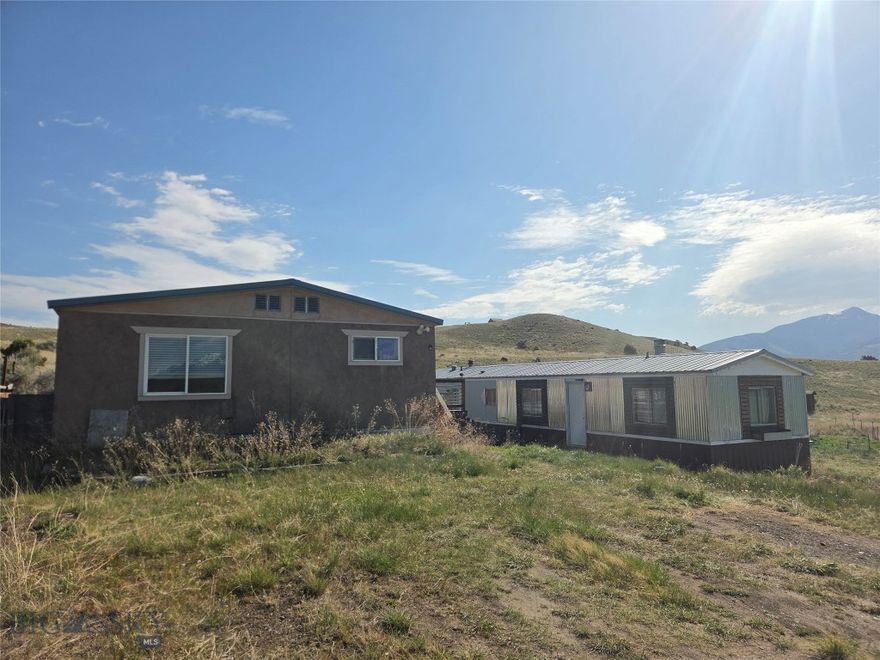 These Two manufactured homes on 6.42 acres provide an excellent opportunity in the heart of Paradise Valley. Whether you're looking for a property to owner occupy, an income-producing investment, or future redevelopment opportunity, this versatile property is well-suited to a variety of strategies. Situated on 6.42 acres with outstanding mountain views, this property features two manufactured homes and exceptional access to outdoor recreation, including nearby Yellowstone River, National Forest lands, and Yellowstone National Park.
Adjacent parcels are also available for purchase, creating the potential to assemble up to 20 total acres. One home is currently generating $1,000 per month in rental income, while the second offers additional rental potential or could serve as an owner-occupied residence.  Both homes are 3 beds, 2 baths.  One is 1450 +/- SF, and the second is 980 +/- SF with an attached garage. Homes are sold As-Is.  Properties don't come along in Paradise Valley at this price point very often.  Call Today!