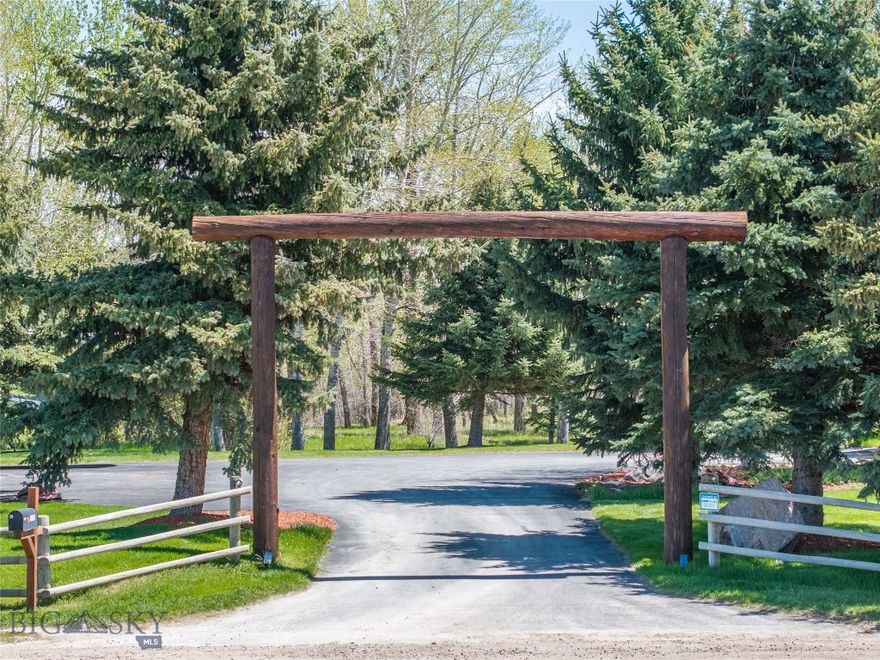 Experience Montana living at its finest on this stunning 4.5+/- acre estate on the outskirts of Bozeman, MT. Fall in love with the main house—3,456 SqFt, 4 beds, 3.5 baths—and the charming guest house—1,360 SqFt, 1 bed, 1 bath, with a bonus room. Additionally, this property features a 3-stall barn (50’x38’), fenced pastures, a 25’x50’ shop with a wood stove, a 3-car attached garage, a fenced yard, a spring-fed pond, and an RV pad with 220V hookup. Enjoy light covenants, direct access to the Gallatin River, world-class fishing, and wildlife viewing right out your back door. Enter this open-concept home from the covered front porch and prepare to be breathtaken by the Montana luxury, custom finishes, and upgrades throughout—from the sawn-oak floors to the tongue-and-groove ceilings. The living room boasts expansive windows, vaulted ceilings, a gorgeous rock fireplace, historic beamed and handmade metal stair railings. The intentionally crafted kitchen offers granite countertops, Thermador appliances, a bar-top island, and a walk-in pantry. Two of the bedrooms have an ensuite (one upstairs, one downstairs), while the other two are located on the second level. Enjoy natural light, amazing mountain views, and the presence of an abundance of local waterfowl. Out the back door, the second-level deck overlooks the pond and mature foliage of the backyard—you can even hear the Gallatin River. The prime location of this property cannot be overstated—just 1.5 miles from Four Corners, 10 miles from downtown Bozeman, 12 miles to BZN-Yellowstone International Airport, and 45 miles to Big Sky Resort. This property has so much to offer from the purposeful and plentiful landscaping to all of attention to detail within the home, mark this as a must see and rare find in the Gallatin Valley—call your agent to see it today!