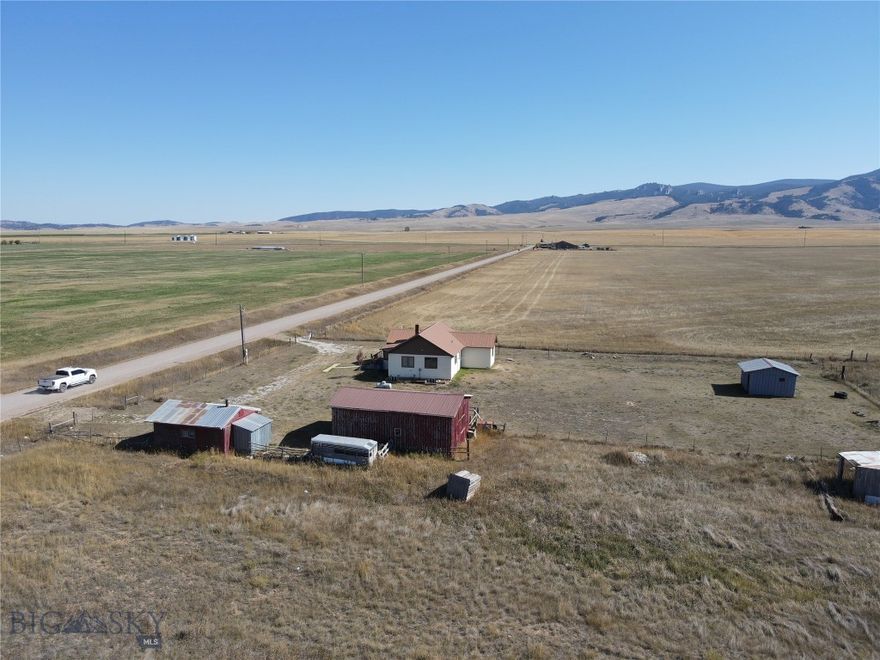 Bring the farm animals! This property is turn key and ready for whatever you dream of since there aren't covenants. Proximity to White Sulphur Springs, yet in the country. The home is full of charm with a dedicated dining room, living room, kitchen, 2 bedrooms, and a full bath on the main floor. The basement with high ceilings has a woodstove, full bath and room to add bedrooms, a den, etc. There are several out buildings for storage, workshops, or as a small garage. Plenty of room to add more dwellings or a business.