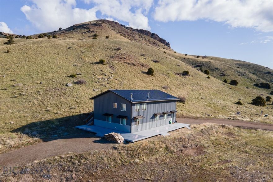 Motivated seller! This is your chance to own your Montana dream retreat on 19 acres in scenic Paradise Valley. Opportunity to live in the current home while building your dream property right next door. This property offers unmatched views of Emigrant Peak, Electric Peak, Dome Mountain, and the breathtaking expanse of Paradise Valley. Current residence is a 2022 build, featuring 2 bedrooms, 2 full bathrooms, great kitchen and open living space with views out every window. A 1,000 square foot attached garage shop space with Hearthstone Castleton high-efficiency wood stove, two 14’ insulated garage doors, 192 square foot loft with storage and workspace with 30-amp and 50-amp service, and 50-amp RV hookup outside. Take in all the views on the 1,000 square foot trex wraparound south facing deck, while still enjoying great privacy. This property is ready for a new owner to be able to build a new home next to the current home on the property. With extensive excavation already completed, separate electrical service installed for the future home, a high-producing well (12 GPM, 660’ depth, 68°F average temperature – ideal for geothermal heating and cooling), a new owner can use the premier building site with completed architectural plans for a custom 3,000+ square foot home or come up with a new concept. Unbeatable location being 2 minutes from the Yellowstone River, 10 minutes from Chico Hot Springs, 20 minutes to Yellowstone Hot Springs, 30 minutes to the North Entrance of Yellowstone National Park, ~30 minutes to Livingston MT, and ~55 minutes from Bozeman MT. Properties like this one don't come along often, don't wait to call this one home!