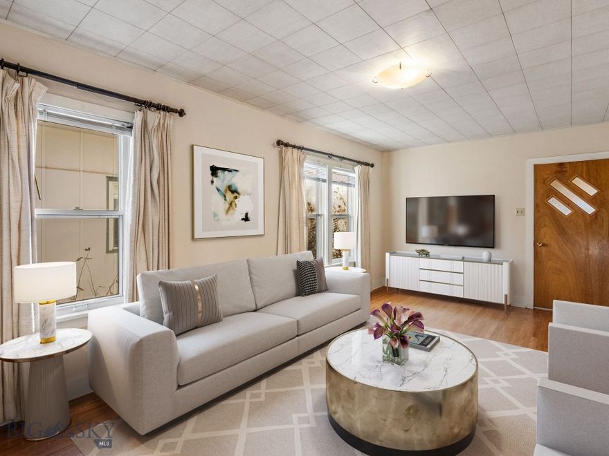 Cute 1950's bungalow between downtown Bozeman and Montana State University campus. Central location for easy access to parks, trails, restaurants, shopping and nightlife. There is no better place to take advantage of the extensive Gallagator trail system that follows Sourdough Creek through town, campus, local dog parks, the M Trail, Triple Tree, and more. The main floor of this classic bungalow features hardwood floors, a covered front porch sitting/ greeting area, an open linear living/ dining/ kitchen layout on the south side, and 2 bedrooms with 1 full bath on the North side. The full unfinished basement is great for storage or future expansion with full laundry hookups and a partial bathroom. Get to the yard from the kitchen or side door allowing for easy access to the grill and bringing in groceries. Mature landscaping throughout the yard allows for shade and privacy. Some neighbors have taken advantage of the alley access of these lots to provide additional off-street parking. Take a tour of this one today and find out what makes the south side of Bozeman so special!