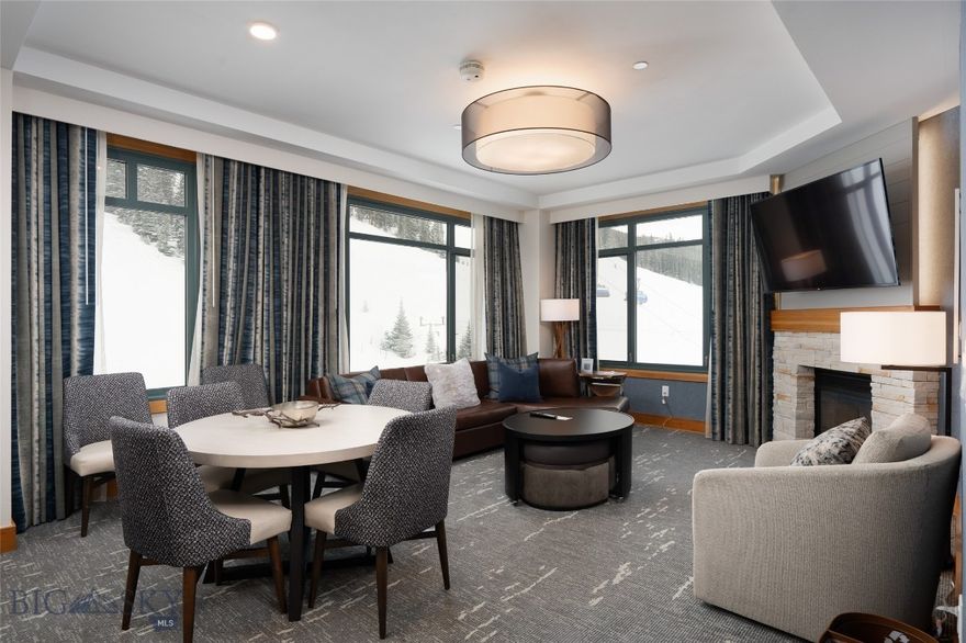 Welcome to your mountain-side retreat in the heart of Big Sky Resort’s Mountain Village. This beautifully remodeled, fully furnished 2-bedroom, 3-bath Summit Hotel residence delivers the ideal blend of convenience, comfort, and breathtaking alpine scenery. Perched on the 7th floor with coveted corner-unit positioning, this spacious 1,322 SF layout spans two connected suites — offering the versatility to enjoy as a single expansive residence or separate guest-ready spaces.

Wake up to iconic Lone Peak rising outside your window, watch skiers and riders gracefully flow down the trails on Andesite Mountain,  unwind as alpenglow dances on the mountain peaks at dusk. The inviting living area features a cozy fireplace and large picture windows that frame the slopes just outside, while the full kitchen and three bathrooms provide everyday ease that’s rare to find in a slopeside hotel condo.

Step outside and into the vibrant Mountain Village environment — just steps from the Ramcharger 8 and Swift Current high-speed blue bubble chairlifts for your skiing, biking, hiking, and sightseeing adventures, Dining, retail, spa services, and après-ski entertainment are easy to find and enjoy. Summit Hotel’s premier amenities elevate every stay: heated underground parking, private owner storage, concierge and bell service, valet, room service, a fitness center, spa, pool, and hot tub — all designed to enhance your time in the mountains.

With fresh updated finishes and a true turn-key offering, this standout floor plan is ready for you to enjoy from day one. Whether you’re carving turns on the mountain, relaxing fireside, or soaking in the hot tub under star-filled skies, this is a place that feels like Big Sky should — slopeside, elevated, and effortless.

Summit Hotel #10707 is the mountain escape you’ve been waiting for. Can you ask for anything more? Contact your favorite Big Sky real estate agent to arrange a showing today.