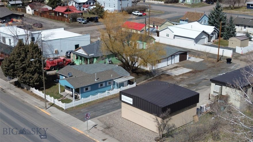 Dual-Use Commercial Property in the Heart of Whitehall – Two Remodeled Buildings, Unlimited Potential

Location, flexibility, and zoning—this rare opportunity checks every box. Situated right in the heart of Whitehall, Montana, this commercially zoned property features two fully remodeled homes on one lot, offering versatile use as office space, retail, live/work setup, or dual rental income. Whether you're launching a new business, expanding an existing one, or building your investment portfolio, this property is a smart and strategic choice.

Positioned in a high-visibility, walkable part of downtown Whitehall, the location provides excellent foot traffic and convenience. Locals and visitors alike stroll by on their way to the post office, grocery store, library, or the Two Bit Saloon. With a public playground and skate park just across the street—and gorgeous mountain views as your backdrop—this is a place where small-town charm meets business opportunity.

The front building, filled with character and natural light, features 3 bedrooms and 1 bath—ideal for converting into a boutique storefront, professional office, or client-facing service business. The picture windows offer prime signage opportunities, while the cozy interior provides a welcoming feel for customers or clients.

Between the two buildings is a fully fenced outdoor area, anchored by a mature weeping willow—perfect for additional seating, outdoor workspace, or relaxing breaks during the workday.

The second building in the rear offers 1 bedroom, a flex/office room, full kitchen, bath, and an attached garage—excellent as a private office suite, rental income unit, or even a creative studio.

Just 50 miles from Bozeman, Helena, and Dillon—and only minutes to Butte—this property puts you in the center of Southwest Montana, with easy access to major routes, local businesses, and outdoor recreation.

Whether you’re envisioning a retail space with on-site housing, a multi-office setup, or a business with income-producing potential, this flexible, zoned-for-commercial property is ready to make it happen.

Opportunity is knocking in Whitehall. Bring your vision—this one’s ready for business.