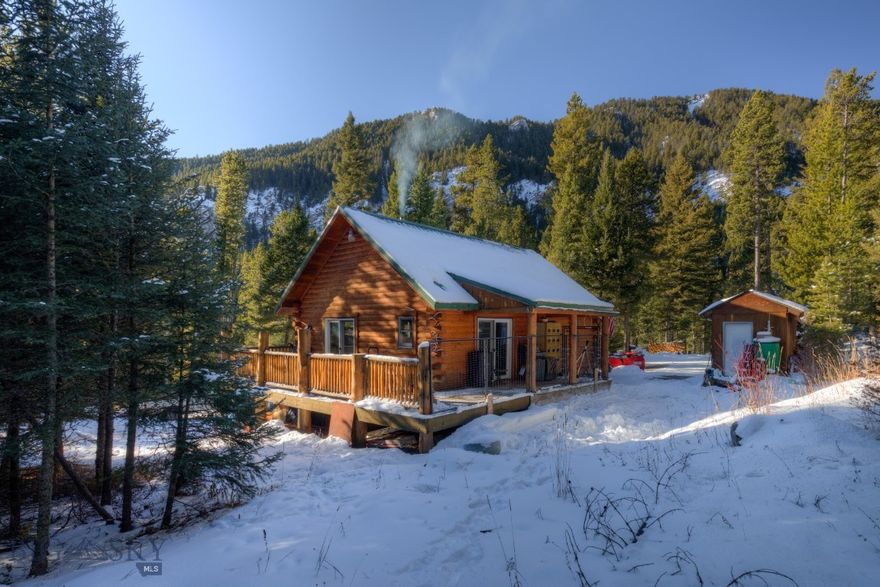 Imagine your mountain getaway cabin accessed by a US Forest Service road, being located in a remote deep forest, surrounded by mountains and bordering US Forest Service and wilderness land. When just minutes away (2 miles) is one of the best summer and winter resorts in America. The community of Big Sky with all of it's amenities is just around the corner with the world famous Big Sky Ski Resort just 12 miles away. Yellowstone National Park is located an hour drive to the south. 
The 2 parcels (Tract 2 - 19.1 acres & Tract 5 - 20.1 ) has Dudley Creek running through parts of the property. 
Tract 2 has a single family residence, divided into separate upper and lower living areas. UPPER LEVEL: 1 Bed - 1 Bath - Loft - Kitchen - Living Area - Large Decks. LOWER LEVEL: Private Entrance - Mud Room - 1 Bed - Bonus Room - 1 Bath - Kitchen - Living Area. 
Tract 5 features an existing 16X24 foundation ready to be built on.
Seller is related to Listing Agent
This is a wonderful opportunity to own a very unique Montana property.  This is Deeded property, not a USFS lease property. 4X4 vehicle required. The house was staged for the photos.