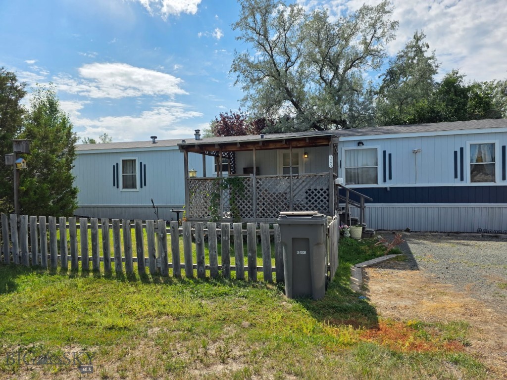 THIS VERY WELL MAINTAINED 3 BEDROOM 2 FULL BATH MANUFACTURED HOME ON A LARGE CITY LOT HAS 1216 SQ. FT. OF LIVING SPACE WITH A LARGE AND WELL USED FRONT COVERED PORCH FOR ENJOYING THE OUTDOORS AND THE YARD IS PERIMETER FENCED, AS WELL! THE OPEN KITCHEN-DINING AREA-LIVING ROOM MAKES THIS A COMFORTABLE FAMILY HOME, OR THIS WOULD MAKE A GREAT RENTAL OPPORTUNITY! COME TAKE A LOOK!