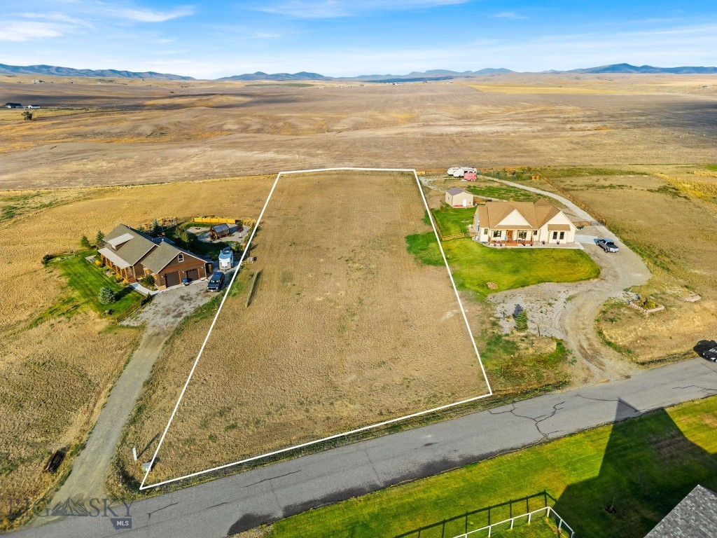 Your Montana Dream Awaits. Discover 1.46 acres of pure potential, just eight miles from the historic town of Three Forks, Montana. If you're searching for beautiful views and room to breathe in an established subdivision away from the hustle of town, this lot is perfect! An opportunity to  build the home you've always envisioned, framed by mountain views that offer a daily display of natural beauty that will never grow old. Located in the welcoming neighborhood of the Village at Elk Ridge Subdivision, this rural retreat is perfectly positioned for both serenity and convenience. Enjoy easy access to Bozeman, Helena, and Butte, all within a short drive, while coming home to quiet nights under the stars. Outdoor enthusiasts will love having year-round recreation just minutes away: golf courses, fishing, hiking trails, camping spots, prime hunting grounds, world-class skiing, and nearby attractions like Headwaters State Park and Canyon Ferry Reservoir. But this property offers more than just a place to live, it’s part of a growing community. There is access to over 25 acres of shared open space that features fantastic community amenities, including a 6-acre park equipped with a basketball court, soccer and baseball fields, a covered gazebo, and BBQ grills, perfect for outdoor gatherings, family fun, and making lasting memories. Don’t just build a house, come and create a home that reflects the peaceful, adventurous spirit of Montana living. Lot 181 is your invitation to escape the urban rush and embrace the lifestyle you’ve been dreaming of.