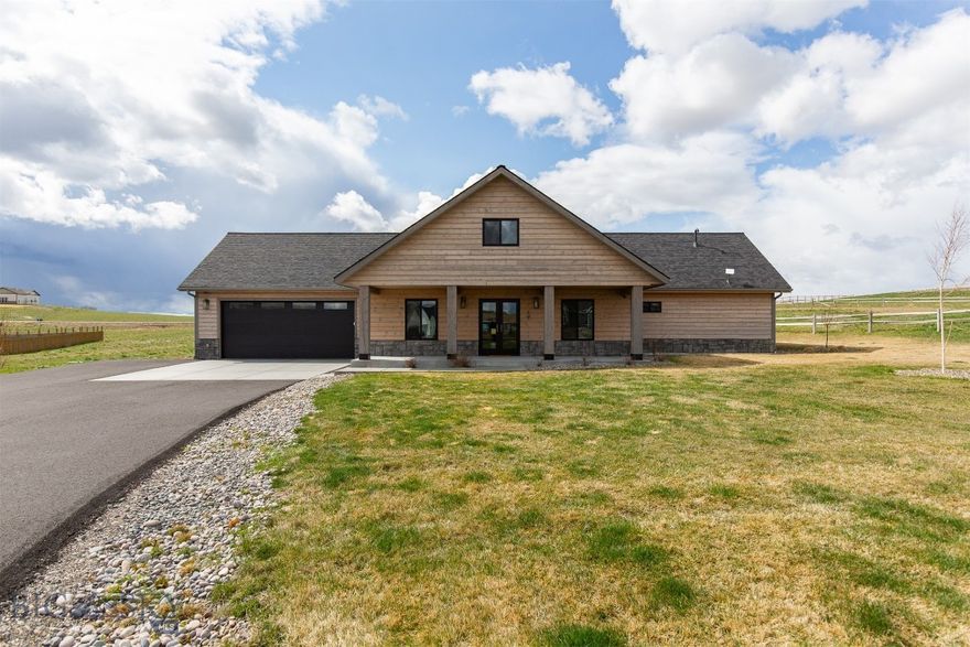 Come see this fabulous home located just outside of Three Forks, MT in the great Village at Elk Ridge Subdivision. This 4-bedroom, 3-bathroom home sitting on 1+ acres is a showstopper! On the main level, you'll find an open concept living room, double sided fireplace. kitchen, dining area with vaulted ceilings. Top shelf kitchen appliances, granite counters, sliding glass doors to a large, covered, outdoor patio area make the space comfortably flow. Just off the living room is a SPACIOUS master bedroom with large bathroom and walk-in closet. Two additional bedrooms, a full bath, and a mud room/laundry area complete the well-designed layout on the main level. 
Upstairs is a nice loft area, a full bath, and a large bedroom that could also be used as additional bonus room area. The two-car garage comes complete with heated concrete floor, drain in floor and plenty of space for extra storage. Outside you will find a large, landscaped yard, incredible views, and a fully finished "shed" with heat that can be used equipment, storage, art studio, playhouse, or anything you can think up. 

In addition to the great floorplan, finishes, views, and yard; this home also contains a reverse osmosis water treatment system, full security system with cameras, water softener, Mini splits also for AC for those warm summer days complete the home.  Driveway was also recently paved.  

Don't miss out on this amazing opportunity in rural Montana! Call your favorite agent today to schedule a showing!
