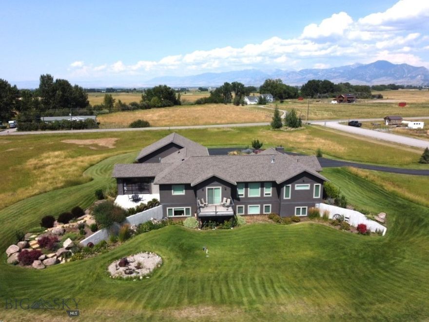 Discover the perfect blend of timeless charm and modern convenience in this stunning custom Craftsman-style home, nestled on three serene acres with a private well and septic. The layout is ideal for many living situations, boasting a well thought out main floor with all living essentials as well as an expansive owner’s suite. On the same level you'll find a cedar sided sunroom/hot tub room that is quite impressive, inviting Bozeman’s outdoors in. With 4 bedrooms, 3 bathrooms, an expansive living room with an additional family room downstairs, an extra room for storage, crafts, etc.. there's plenty of room for your imagination to roam free and make this house your dream home! Some of the custom finishes to highlight are: solid oak hardwood flooring, live edge granite counter tops, wood doors and trim, heated tiles flooring, and 9 foot ceilings. Step into the oversized 3 car garage (plumbed for a gas heater) and also enjoy the newly re-surfaced driveway for all your toys. If you're dreaming of lush gardens, a private retreat, or space for your horses, look no farther. With minimal zoning restrictions and covenants fit for rural Montana living, you have the incredible flexibility to customize your property to your heart's desire. Enjoy the open pasture with your horses and other pets. Enjoy breathtaking 360° Views: Wake up to panoramic vistas every morning, with stunning views in every direction that capture the beauty of the Gallatin Valley. Close to Town: Enjoy the peace and privacy of country living, while still being just minutes away from shopping, dining, and all the conveniences of town life. Located in desirable Anderson School District. This is more than just a home—it's an opportunity to create the lifestyle you've always wanted. Don't miss out on this rare gem. Schedule your private tour today!