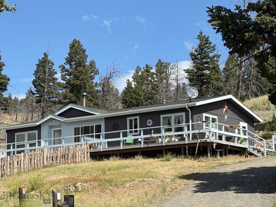 COUNTRY LIFE ON 10+/-ACRES PLUS A 3 BEDROOM, 2 BATH HOME OFFERING 1,404+/-SF PLUS A KITCHEN WITH A FUNCTIONAL ISLAND PLUS ALL FIXED KITCHEN APPLIANCES, LAUNDRY / MUD ROOM WITH WASHER/DRYER AND A LIVING ROOM WITH WOOD STOVE.  THE TREX DECK OFFERS PLENTY OF SPACE FOR OUTDOOR ENTERTAINING AND NICE VIEWS TO TAKE ALONG WITH THE SUNSET.  THERE IS A DETACHED HEATED GARAGE, 2 SHEDS, A LOAFING SHED, 2 FENCED PASTURES; THE BOTTOM PASTURE OFFERS A BABBLING CREEK FOR LIVESTOCK.  PROPERTY IS EASILY ACCESSED OFF HWY 2.  ENJOY COUNTRY LIVING WITH PRIVACY AND RELAXATION AT 180 LOWER RADER CREEK.
