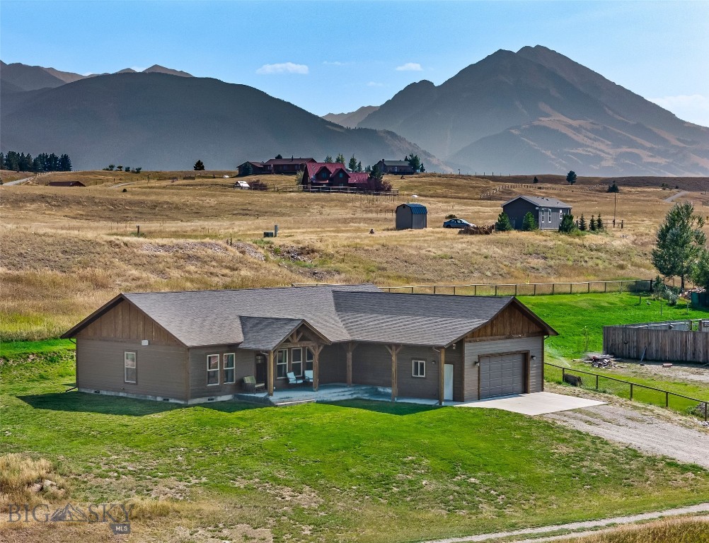 This beautifully crafted single-level home, completed in 2022, offers modern design, privacy, and effortless living in the heart of Paradise Valley. Set on a private ¾-acre lot, the property provides room to breathe while still being close to everything.
Inside, you’ll find 3 bedrooms and 2 bathrooms, vaulted ceilings, and an open floor plan filled with natural light. The modern kitchen is outfitted with custom wooden cabinetry, while the adjoining dining area features a convenient wet bar/coffee station—perfect for entertaining or starting your day with ease.
The spacious primary suite includes a large walk-in closet and a luxurious en suite bathroom with tiled floors. Additional highlights include a thoughtfully designed single-level layout, a covered front and back porch for year-round enjoyment, and a roomy attached 2-car garage.
Located off Chicory Road, this property is just a short walk to public access on the world-renowned Yellowstone River. You’re also only minutes from Chico Hot Springs, Sage Lodge, and a quick drive into downtown Livingston with its vibrant shops and restaurants.
Experience comfort, privacy, and the Montana lifestyle in this move-in ready home.
