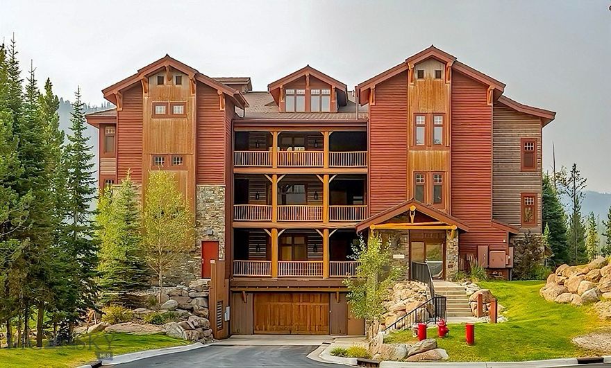 Offering an unparalleled living experience at the base of Big Sky Resort, this 3-bedroom, 3-bath condominium encompasses 2,007 square feet of elegant mountain living. Every detail reflects thoughtful craftsmanship and timeless design, with radiant heated hardwood floors, knotty Alder doors and trim, Viking appliances, granite countertops, and a spa-like master suite with a jetted soaking tub—perfect after a day on the slopes. 

Designed for both comfort and entertaining, the open concept living room, anchored by a cozy fireplace and expansive windows, invites you to gather with friends while taking in breathtaking views of Lone Peak and Lake Levinsky. A covered balcony extends the living space outdoors, providing a front-row seat to Big Sky’s alpine beauty. Each private suite offers its own bath ensuring privacy and comfort. Convenience is unmatched with a private underground single car parking garage, additional outdoor parking, and direct access to the Skyline shuttle stop—ensuring effortless connection to skiing, dining, and resort amenities. 

Beyond your door lies the heart of Big Sky Resort.  Providing a picturesque backdrop of natural beauty that enchants residents and visitors alike.  In winter, enjoy direct access to world-class skiing and snowboarding. In the warmer months, explore hiking in Beehive Basin, biking the Mountain to Meadow trail, kayaking on Lake Levinsky, fly fishing Montana’s legendary Blue Ribbon waters, or venturing into the wild beauty of Yellowstone National Park. This property not only provides a luxurious retreat but also a front-row seat to Big Sky’s year-round adventures. 

Tastefully furnished, every corner exudes warmth and sophistication, The residence is being offered fully furnished and turnkey, with existing rentals already on the books—a rare opportunity for both personal enjoyment and immediate revenue potential. Please inquire for detailed cost of ownership and revenue forecasting. Whether you’re seeking a private getaway, a luxurious base camp for outdoor pursuits, or a high-end short-term rental, this condo is more than a home—it’s your personal retreat in Montana’s most sought-after resort community.
