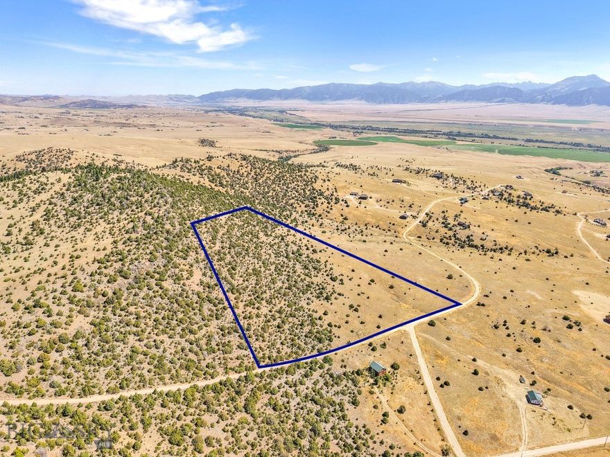 Take in the sweeping views of the Madison Range and Madison Valley from this stunning 15.5+/- acre hillside property. An ideal site for your dream home or cabin retreat, the upper portion of the parcel features dramatic rocky outcroppings and mature trees, adding character and privacy. Owners in good standing enjoy exclusive access to the trout-stocked Haypress Lakes. With Axolotl Lakes, Varney Bridge Fishing Access, and miles of public land just minutes away, the recreational opportunities are endless—hiking, fishing, hunting, ATVing, and wildlife watching are right out your back door. A one-time $2,500 building fee applies. Conveniently located just a short drive from Ennis for shopping, medical care, dining, and other services.