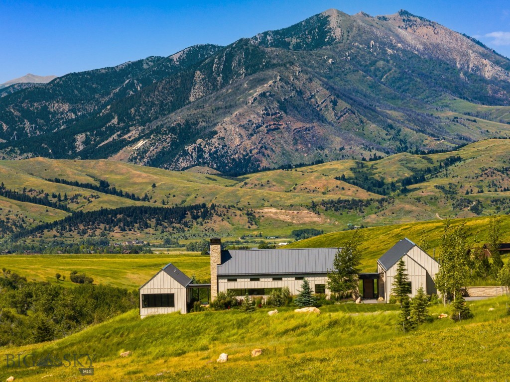 Welcome to 1878 Star Ridge Road—an exceptional custom residence set on 20 private acres in Bozeman’s premier Eagle Rock Reserve community. Thoughtfully designed to embrace the surrounding landscape, this 4,105± sq.ft. home captures sweeping, unobstructed views of the Bridger Mountains and offers a harmonious blend of refined comfort, privacy, and natural beauty.
Built in 2019, the home features 4 bedrooms, 3.5 bathrooms, a dedicated office, and a spacious game room or workout room. The centerpiece living area boasts floor-to-ceiling windows that flood the space with natural light and showcase breathtaking mountain and meadow vistas. Automated blinds throughout add ease and sophistication.
The chef’s kitchen is both stylish and functional, with a large island, premium finishes, and a generous walk-in butler’s pantry—ideal for entertaining and everyday living.
Luxury amenities include an in-home sauna, in-ground hot tub, indoor wood-burning fireplace, and a covered patio with outdoor gas fireplace, all surrounded by beautifully landscaped grounds that enhance the home’s sense of peace and seclusion.
As a resident of Eagle Rock Reserve, you’ll enjoy access to private community ponds and a barn, the ability to board horses, and the convenience of an on-site ranch manager.
Whether you're soaking in the views from the patio or exploring the property's peaceful acreage, this is Montana at its finest. A private retreat that gives you instant access to community trails and state land located just 10 minutes from Downtown Bozeman.