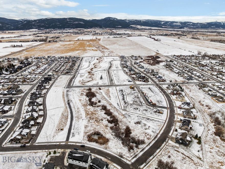 Welcome to Meadow Bridge, Bozeman’s newest premier neighborhood on the desirable south side. This thoughtfully planned subdivision features 45 fully entitled homesites, ranging from approximately 4,000 to 14,000 square feet—perfect for bringing your custom dream home to life. Enjoy breathtaking views of the Bridger Mountains, enhanced privacy, and direct access to open space and nearby parks. Ideally located just minutes from historic Downtown Bozeman, Meadow Bridge offers convenient access to dining, shopping, recreation, top-rated schools, and Montana State University. This is a rare opportunity to build in a quiet, close-knit community while still enjoying all the amenities Bozeman has to offer. Despite its compact footprint, the lot's adjacency to open space provides a sense of openness and scale typically found with larger lots. With generous lot sizes and flexible design options, you have the freedom to create a home that fits your lifestyle—whether you envision a modern farmhouse, a charming cottage, or a thoughtfully designed two-story home. Bring your builder and turn your vision into reality at Meadow Bridge.