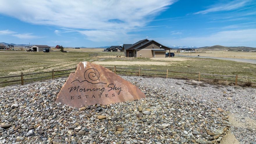 Are you ready to embark on the journey of building your dream home? Look no further than this exceptional 3.5-acre lot nestled within the prestigious Aurora Loop subdivision. Offering unparalleled advantages, this premium lot promises an idyllic canvas for your future abode. Situated amidst breathtaking natural beauty, this lot boasts panoramic views of the surrounding mountain ranges. Imagine waking up to the serene vistas each morning and relishing in the tranquility of your private oasis. One of the standout features of this property is its proximity to nature and recreational amenities. Backing onto a sprawling 7.5 acres of designated park space, you'll have endless opportunities for outdoor adventures right at your doorstep. Whether it's exploring the nearby Copper City trail system, marveling at the wonders of Lewis & Clark Caverns State Park, or indulging in fishing along the renowned rivers that grace Three Forks, MT, there's something here for every outdoor enthusiast. Moreover, the convenience of this location cannot be overstated. Just a stone's throw away from the charming town of Three Forks, MT, you'll have easy access to local favorites such as golf courses, restaurants, and various activities. Additionally, with Bozeman Yellowstone International Airport (BZN) a mere 29 miles away, travel becomes a breeze. Before you start envisioning your dream home, it's important to note that this build-ready lot requires a few steps for construction commencement. Securing necessary permits from the Broadwater County Sanitarian for septic installation and obtaining approval from the Design Review Committee (HOA) are essential first steps. Rest assured, electricity is readily available on-site, while the responsibility of installing a private well, septic system, and propane tank service falls upon the buyer. While there's no zoning in place, an active HOA ensures the maintenance of community standards through recorded Covenants and Bylaws, safeguarding your investment for years to come. If you're ready to take the next steps towards making this property yours, don't hesitate to reach out to me or your preferred Realtor for further information and assistance. Your dream home awaits—seize this opportunity to create a lifetime of memories in the heart of Montana's picturesque landscape.