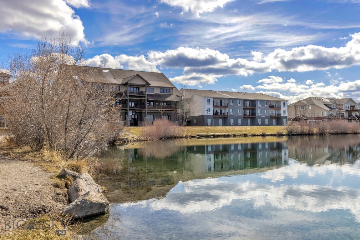 This studio condo in Belgrade offers a practical and comfortable space with thoughtful touches throughout. Located in a secure building next to a quiet pond, it’s a simple, low-maintenance option in a convenient spot. Inside, the unit features wood floors, industrial-style finishes, and plenty of natural light. A washer and dryer are included.
The building offers conveniences including an elevator, on-site grocery store, and a gym just out front. Walking paths nearby provide access to the outdoors without going far. Whether you're a first-time buyer, student, or looking for a lock-and-leave property, this condo is the perfect choice. Investment opportunity potential with short-term rental history is available. Located just 5 minutes from I-90, 10 minutes from the airport, and about 20 minutes to Bozeman, it’s a straightforward spot with good access to everything you need.