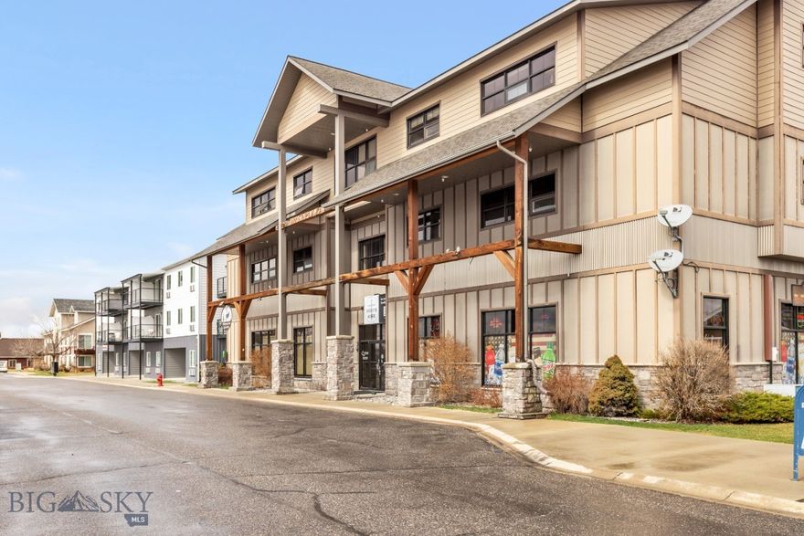 This studio condo offers a bright, functional space with thoughtful design and low-maintenance living. Located in a secure building beside a quiet pond, it features wood floors, industrial-style finishes, and abundant natural light. A washer and dryer are included for added convenience.
The building provides everyday ease with an elevator, on-site grocery store, and a gym just outside the door. Enjoy nearby walking paths and easy access to I-90, the airport, and Bozeman. Ideal for first-time buyers, students, or those seeking a lock-and-leave property—with investment potential and a history of short-term rentals.