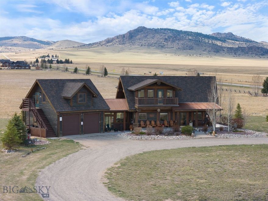 Welcome to your Montana dream home! Nestled on 5.67 acres in the desirable Pronghorn Meadows community, this stunning 2,258 sq ft log cabin offers the perfect blend of rustic charm and modern comfort. Ideally located near Bozeman, West Yellowstone, and the world-renowned fly fishing and recreation of Ennis, this property is a true outdoor enthusiast’s paradise. Inside, you’ll find a bright, open living area anchored by a cozy gas stove — perfect for warming up after a day of adventure. The kitchen is a showstopper with granite countertops, a stunning custom live-edge Madison River countertop on the island, and custom pull-out cabinetry offering excellent storage. Adjacent to the kitchen, a dedicated dining area provides a warm and inviting space for gatherings and meals. A spacious laundry room with a stylish vessel sink and half bath adds to the home’s thoughtful design. Upstairs, the loft leads to the luxurious primary suite, featuring a private balcony with breathtaking views of the Madison Mountain Range. The ensuite bathroom offers a double vanity, a private toilet room, a custom-tiled walk-in shower, and an additional balcony. A large walk-in closet and extra storage closets complete this beautiful retreat. The lower level includes a comfortable family room, two guest bedrooms, and a shared full bathroom are ideal for hosting family and friends. Outdoor living is a highlight with covered patios that include an outdoor bar which is ideal for entertaining under Montana’s big sky, plus a charming front deck to take in peaceful morning sunrises and evening sunsets. A breezeway connects the main home to the 2-car garage, above which sits a charming 672 sq ft guest apartment with its own private entrance. The apartment includes a kitchenette, full bathroom with washer/dryer hook-ups, living area, and bedroom space and comes fully furnished. Featured on the Ennis Home Tour in 2019, this property is a rare find, offering privacy, stunning views, and luxurious finishes throughout. Don’t miss this opportunity to own a piece of Montana paradise!