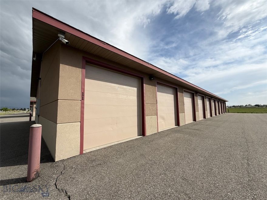 If you own a vacation home near Big Sky or Bozeman, or if you're simply a frequent flyer tired of the parking lot shuffle, this private indoor garage unit at Bozeman Yellowstone International Airport might be exactly what you've been looking for. Unit D-13 is a 12' x 24' enclosed garage with a 9' x 9' door, plenty of room for a full-size truck or SUV. Fully enclosed and conveniently located near the terminal, it keeps your vehicle protected from Montana's notoriously unpredictable weather. No more returning to a snow-buried car after a two-week trip. No more scraping ice before a 6 a.m. departure. Keyless number-pad entry keeps things simple and secure, with an electrical outlet inside for an engine block heater or battery tender. Access to Interstate 90 — connecting you quickly to both Bozeman and Belgrade — is right there when you need it. The HOA covers electricity, snow plowing, and security, making this a genuinely low-maintenance ownership experience. Unit D-13 puts your vehicle exactly where you need it — safe, dry, and ready to drive!