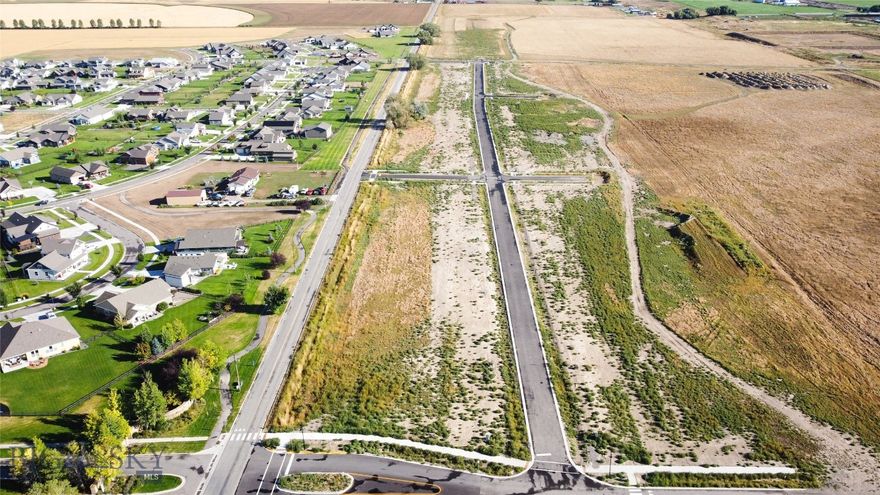 Manhattan Meadows, a premier homesite offering the perfect blend of space, scenery, and small-town Montana charm. Set within one of Manhattan’s newest subdivisions, this spacious lot provides the ideal foundation for your custom home—whether you’re dreaming of modern farmhouse, traditional ranch, or a contemporary Montana design. Enjoy wide-open Bridger views and the peaceful setting that Manhattan is known for. With level terrain and convenient utility access, this lot is truly build-ready. Manhattan Meadows offers a thoughtful neighborhood layout, paved roads, and easy access to schools, dining, and the local grocery while still being only minutes from I-90 for quick trips to Bozeman, the airport, or outdoor recreation. This lot backs to a small park strip!