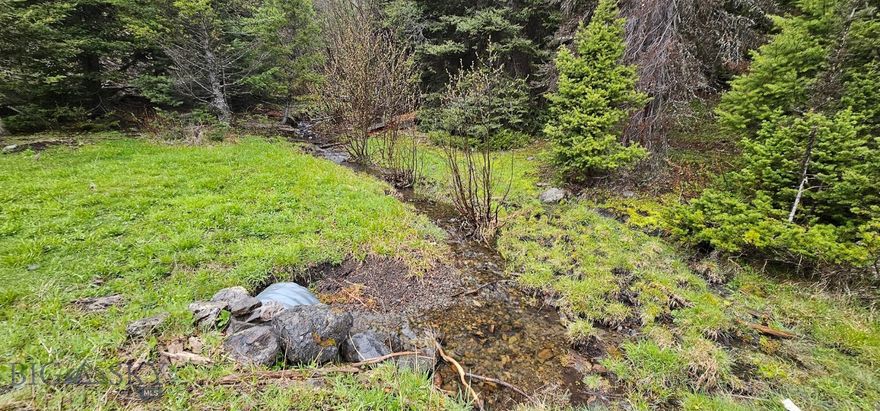 160+/- Acres – Off-Grid Land in Drummond with Wildlife, Water, and Stunning Building Sites. Explore this remarkable 160-acre property for sale near Drummond, MT, nestled in the scenic Garnet Range. A rare opportunity to own Montana acreage featuring a peaceful pond, natural springs, and abundant wildlife. With multiple ideal building sites, this off grid recreational property for sale is well-suited for your seasonal dream cabin. The rolling hills, mountain views, and secluded location offer unmatched tranquility and privacy, while still accessible via easement road. Whether you're looking to buy land in Drummond MT, invest in Granite County land for sale, or secure a property with wildlife and water, this off-grid property in Drummond checks every box. It's a top choice for those interested in recreational land, land with springs, or horses-allowed parcels. Don’t miss this land investment opportunity close to Drummond MT—a beautiful blend of nature, privacy, and potential.
