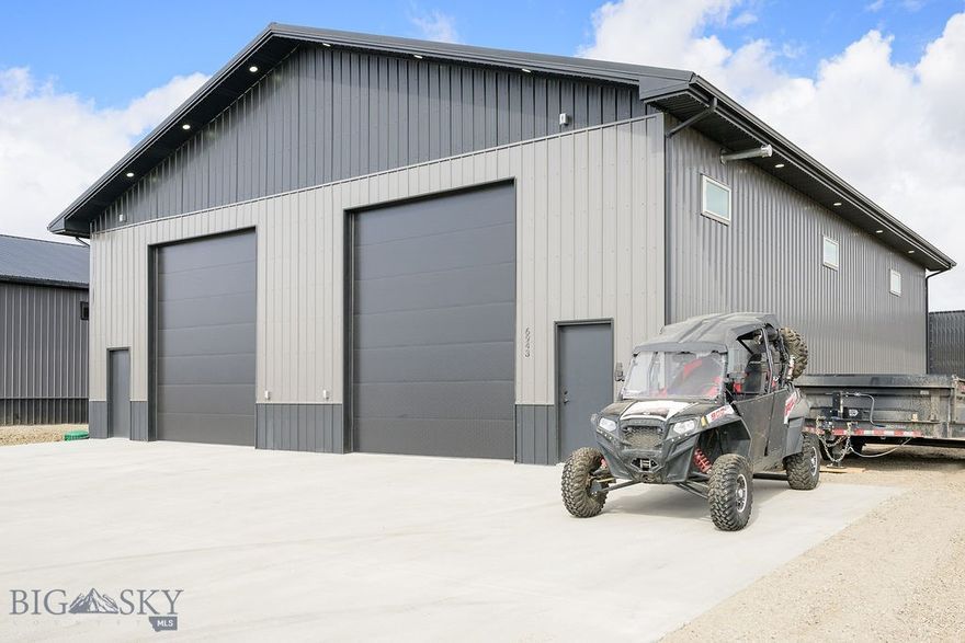 48' x 60’ shop built on a monolithic slab to increase durability and lifespan. Concrete driveway and an approx. 20’ parking area on the side of the building with the potential space to add more. Steel siding and steel roof. There are two 12’ wide by 14’ tall Midland garage doors with Liftmaster openers. Inside the shop there is a built-in divider in the ceiling that allows the option of dividing the shop into 2 equal halves with 220V service to both sides. (Amazing investment and work/life potential!) There are also two separate bathrooms to accommodate the potential for dividing the shop. And upstairs you will find a fully enclosed 10x48 mezzanine area with numerous electrical outlets and windows. The shop is heated with two 100,000 BTU heaters, and there is space to add an on-demand water heater. The shop is also equipped with permanent, programmable, holiday lighting (holiday pattern or decorative when it’s not the holiday season) professionally installed by Yellowstone Trimlight. The shop is located on Lot 3 on Airstream Ave within Shopworld, with quick and easy access to Monad Road. Info deemed reliable but not guaranteed. Buyer/buyer agent to verify.