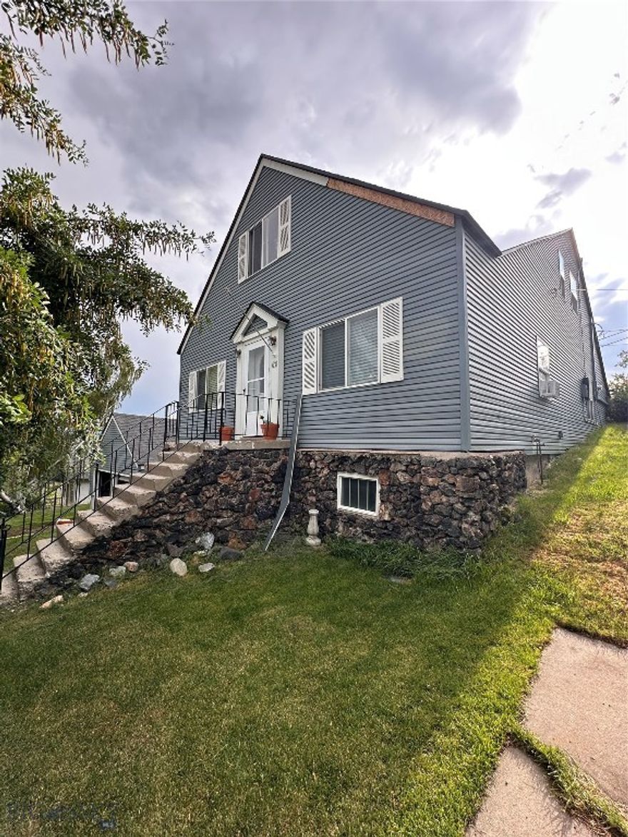 Welcome to this spacious and beautifully maintained 4-bedroom, 2-bathroom home perfectly located near St. James Healthcare and just minutes from Montana Tech. Whether you’re looking for a comfortable family home, a peaceful retreat, or an excellent investment property for student housing, this home has it all.

Step inside to find a bright and welcoming living room, a functional kitchen with ample cabinet and counter space, and four generously sized bedrooms that provide plenty of room for everyone. Both bathrooms are clean and conveniently located for easy access.

One of the standout features of this home is the private back deck, where you can start your mornings with coffee while enjoying the crisp Montana air or unwind in the evenings with friends and family. You’ll love the beautiful natural setting, with local deer often visiting the yard and coming right up to the deck – creating a true sense of peace and connection to nature.

Step into a spacious 1,619 sq ft basement that offers endless potential. You'll find ample storage throughout, ideal for keeping seasonal items, tools, or hobby equipment neatly organized. One standout feature is the dedicated grow room—perfect for indoor gardening, hydroponics, or a year-round green thumb setup.

Outside, the property offers off-street parking and a beautiful yard, giving you more time to enjoy what matters most. Its prime location offers unmatched convenience while still providing a sense of privacy and tranquility.
