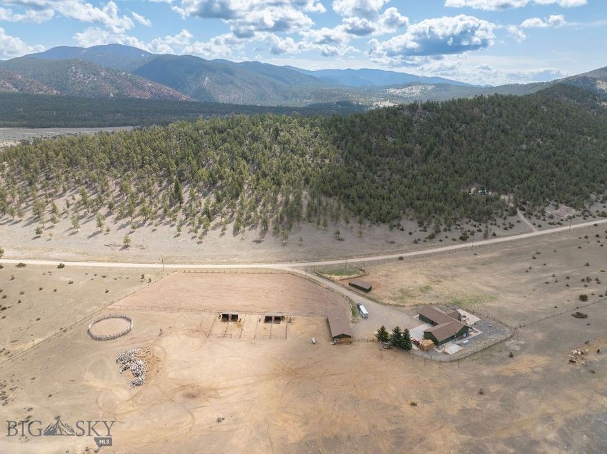 Dream Montana property on 40 acres with everything you need for comfortable living and serious horse keeping. The home offers main-level living with vaulted ceilings, large windows, and an open-concept design that brings in natural light and stunning views. The main level includes a spacious kitchen, cozy living area with fireplace, and a private master suite.
Equestrian features include a well-equipped tack room, multiple stables, fenced pastures, and a professionally built riding arena — ideal for training, leisure riding, or events. Plenty of space for grazing, rotation, and future customization. Additionally, enjoy nearby lake recreation with the private community docks and pavilion. Enjoy privacy, open skies, and the best of Big Sky Country. Whether you're an equestrian enthusiast or simply seeking a serene rural lifestyle, this property offers the perfect Montana retreat. See MLS #405856 for home and smaller 20-acre parcel.