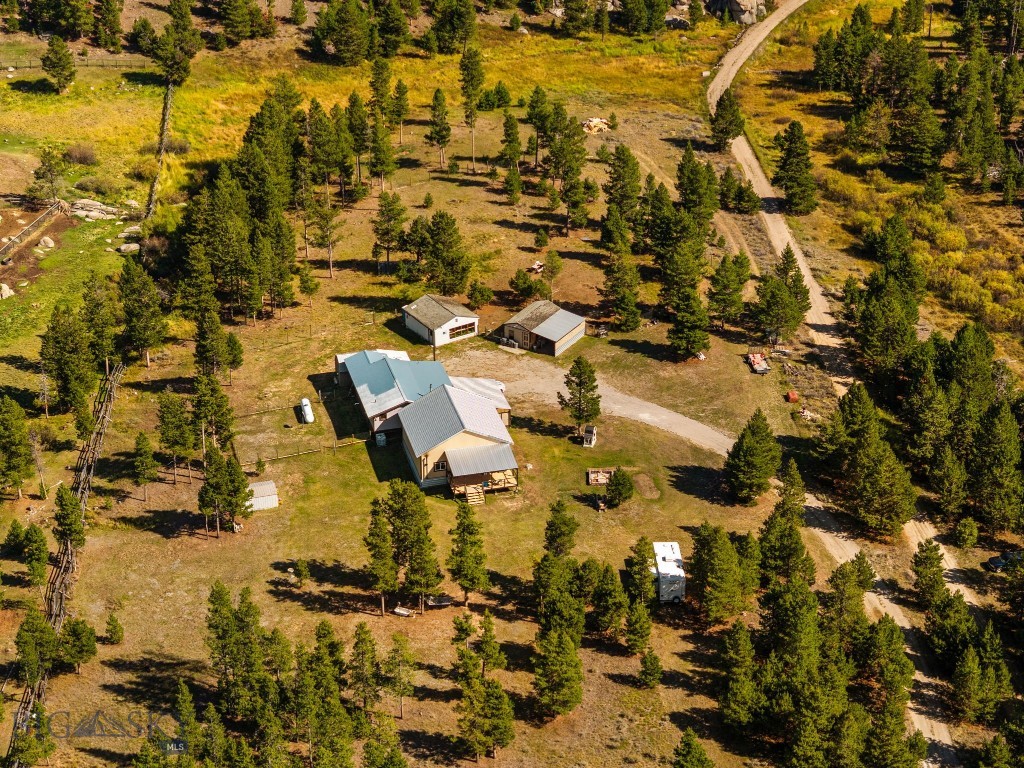 Welcome to a home where country living and outdoor adventure come together. This 4-bedroom, 2-bath sits on just over 10 acres with no HOA, giving you the freedom to live the Montana lifestyle your way. A brand-new addition makes it easy to gather friends and family—whether for holidays, celebrations, or quiet evenings by the fire.
The property is set up for goats, chickens, turkeys, and more, with fencing that secures your animals while still allowing wildlife to pass through. A seasonal creek adds to the setting, creating a peaceful backdrop right outside your door.
Adventure begins the moment you step outside. The Continental Divide Trail, Thompson Park, and Beaverhead - Deerlodge National Forest are all close by, offering endless opportunities for hunting, hiking, biking, horseback riding, and wildlife viewing. And when you need to connect with the wider world, Butte and Bert Mooney Airport is about a 15 minute drive away.
Here, mornings start with feeding animals, afternoons with a trail ride or mountain hike, and evenings watching the elk, deer and more with family gathered close. This isn’t just a home—it’s pure Montana living.