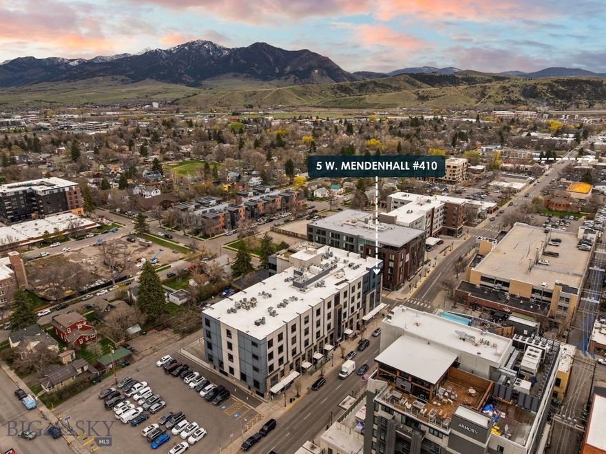 Welcome to this stunning, high-end furnished condo, ideally located in the heart of downtown Bozeman. This modern residence boasts three spacious bedrooms, each featuring en-suite bathrooms, ensuring privacy and comfort for everyone.

Step inside to discover a meticulously designed gourmet kitchen that is a chef's dream. Outfitted with a 48" Thermador gas range, two Thermador refrigerators, a wine fridge, and two additional beverage fridges, this kitchen is perfect for entertaining or enjoying everyday meals. The adjoining living and dining areas seamlessly flow together, highlighted by custom-built-ins that provide ample storage.

This luxurious condo is flooded with natural light thanks to its southern exposure and is equipped with convenient electric blinds and a surround sound system, creating an inviting atmosphere. Additional features include a dedicated office space, a laundry room, and a half bath for guests.

The outdoor rooftop patio offers breathtaking views of the surrounding mountain ranges, making it an ideal spot for relaxation or social gatherings. Residents will appreciate the security of this well-maintained building, while two assigned parking spaces in the garage provide convenience and peace of mind.

With its perfect blend of elegance and functionality, this condo presents a rare opportunity to enjoy a sophisticated lifestyle in the heart of Bozeman. Don’t miss your chance to call this exceptional property home!