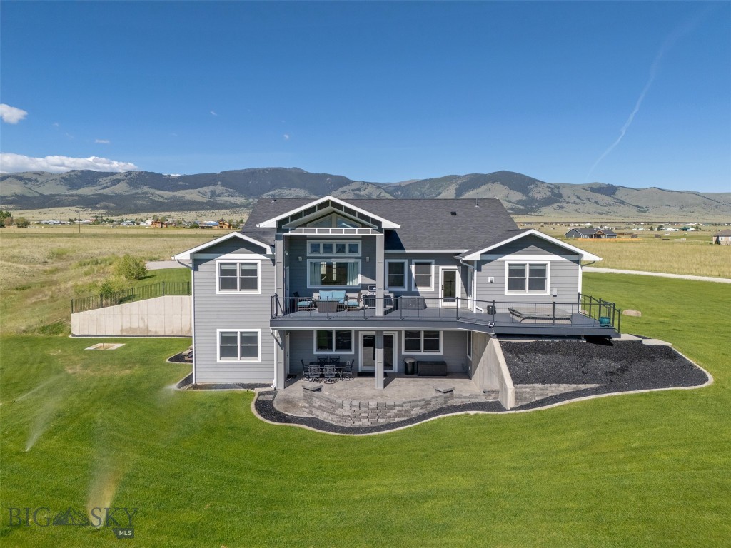 This remarkable property overlooking Canyon Ferry lake embraces luxury living at its finest. Situated on nearly 7 acres, the 5328+/- SF custom home is absolutely stunning, with high quality construction and added amenities and features not commonly found. During the design and build phase, if the owners thought they needed it, they did it. Walking into the main level, you're immediately greeted by the vaulted living room ceiling, attractive tile floors, an 8' wall mounted fireplace, open dining area and a gourmet kitchen. The kitchen has an array of cabinets, gas range top with pot filler, double oven, large center island, granite countertops, under counter and cabinet lighting, and a hidden butler's pantry with additional freezer. There are 3 bdrms, including a spacious master bedroom and ensuite bedroom, both with large walk-in closets, beautiful showers and entrances to the deck. The spacious covered deck overlooks the lake with tremendous views of the mountains beyond. Providing morning sunshine and evening shade, it's a perfect place for peaceful relaxation. The basement is an entertainment mecca. The main area has an extravagant wet bar, with seating for approx 10, a fridge, kegerator, ice maker, dishwasher and microwave. A large projection TV and hookups for several wall mounted TVs offer a great place to enjoy movies or watch sports. There's also a workout room, 2 guest bedrooms and a full bath. The entertainment room walks out onto the covered patio and lawn for outside enjoyment. In addition to the attached 3 car heated garage, a 40' x 66' heated and insulated shop provides storage for boats, RVs, or ATVs. The shop ceilings are 16'. There are three 12' and one 14' overhead doors in the main shop area, as well as another 14' door for the separate RV bay. There's also a bathroom, an outside 30A RV receptacle and dump station with a dedicated septic tank. Additional amenities include in-floor radiant heat throughout the house, A/C, whole house surround sound system, underground sprinklers, two 1000 gallon buried propane tanks, horseshoe pits, propane plumbing to patio and upper deck for grilling, spray foam insulation in home and shop (including privacy insulation in the master and ensuite bedroom walls). Located in a desirable subdivision within a few minutes of the Silos boat ramp and recreation area, this property checks off a lot of boxes for those looking for lake life, recreation, views, elbow room, and the true enjoyment of Montana living.