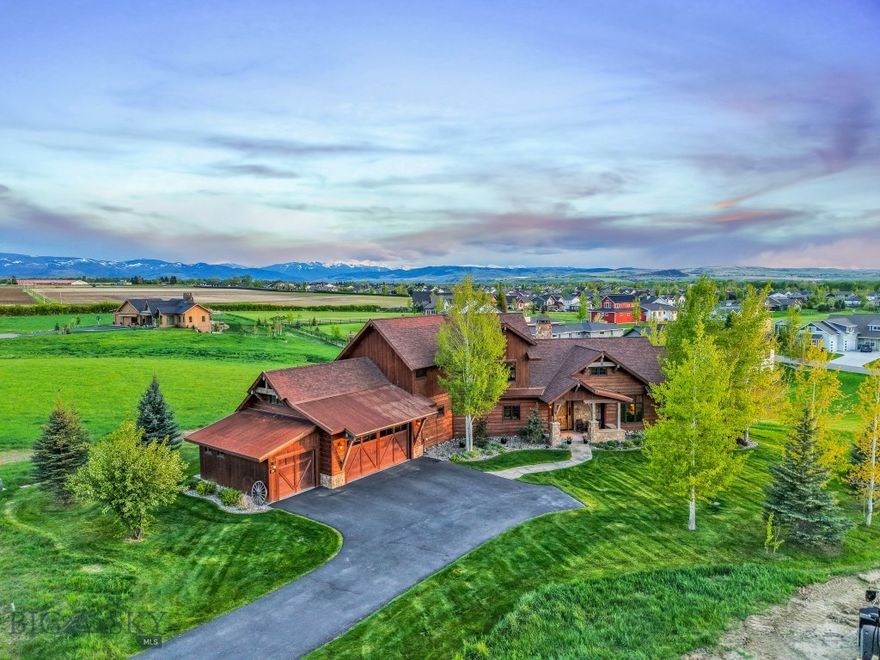 Welcome to 171 Brave Heart Loop, a masterfully designed home built by Teton Heritage Builders in the prestigious Black Bull Golf Community. Located on the south side of the neighborhood, this area is known for its elevated privacy, higher-end homes, and more protected setting — offering a quiet and refined lifestyle that stands apart from the rest of the community.

This 5-bedroom, 4-bathroom custom residence offers 3,253 square feet of beautifully curated living space on a .63-acre lot that backs directly to protected parkland in Middle Creek Parklands. Enjoy the rare advantage of open views, no rear neighbors, and the calming presence of natural green space right out your back door.

Inside, the home showcases luxury finishes and thoughtful craftsmanship throughout. The main level features stunning Douglas Fir cross-cut hardwood floors, vaulted ceilings, and expansive windows that frame the mountains. The kitchen is a true centerpiece, offering granite countertops, a large center island, dual wall ovens, a gas cooktop with pot filler, and walk-in pantry. Accordion-style patio doors lead to a covered deck with a private hot tub (included), creating the ultimate indoor-outdoor lifestyle.

The primary suite on the main level is a peaceful retreat with heated tile floors in the bathroom, a freestanding soaking tub, walk-in shower, and a generous custom closet. Also on the main level, you’ll find a second en suite bedroom, a guest bedroom, and a generous mudroom/laundry space. Upstairs, two additional bedrooms and a spacious family or media room offer flexibility for guests, children, or multigenerational living.

Additional features include central A/C, a whole-house humidifier, recirculating hot water, and an oversized 3-car heated garage with built-in storage. The landscaping is manicured and supported by underground sprinklers, and the blacktop driveway completes the pristine curb appeal.

As part of the Black Bull community, residents enjoy access to a full suite of amenities, including a swimming pool, fitness center, on-site restaurant, and walking trails. For golf enthusiasts, Black Bull offers a private, championship 18-hole course designed by Tom Weiskopf — with golf memberships available separately (limited quantities, buyer to verify).

Set within one of Bozeman’s most desirable neighborhoods and just minutes from top schools, shopping, and recreation, this home offers a rare blend of luxury, privacy, and Montana lifestyle at its best.