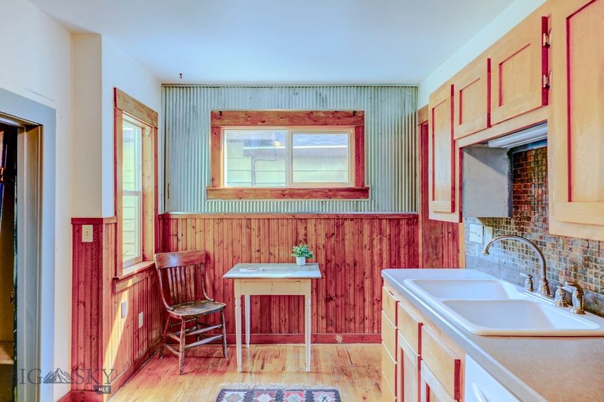 Location, location!  Built in 1910 this Victorian style charmer is waiting for your vision.  Sitting in a prime location on South 5th Street the 5,320 sq ft lot features a second building off the alley.   From the front porch you enter an enclosed porch with an entry to the main livingroom through double doors to hardwood floors.  The home is the old style, two bedrooms upstairs, one down with the full bath adjoining it.  Lots of potential, with projects for you to finish.  The second building in the back off the alley was once someone's home. With some work this building might  be a great rental, second generation home, or  studio. Cadastral lists it as two dwellings. This is not a polished property but worth looking at for the right type of buyer.
