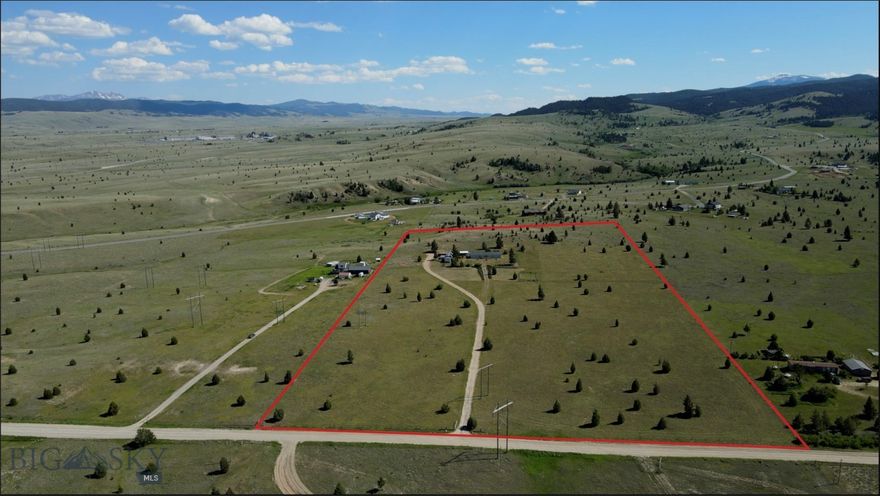 Enjoy the best of both worlds with a serene country setting that’s still close to town.  Nestled on 20 acres just west of Butte, this property provides excellent year-round road access and breathtaking views of the surrounding mountain ranges.  The area is rich with wildlife and free from covenants, making it ideal for outdoor enthusiasts.  The house offers over 2,150 square feet of single-level living space, featuring an open floor plan that seamlessly integrates the kitchen, dining area, and family room. Additionally, it includes a separate living room, a spacious master suite, and a versatile office/den/bonus room.  The entire property is enclosed with perimeter fencing, and there is an additional fence around the house for pets.  Other features include a garage/workshop and a corral for horses and other livestock.  If you’re looking for a rural property that offers the convenience of city services, this one is a must-see!