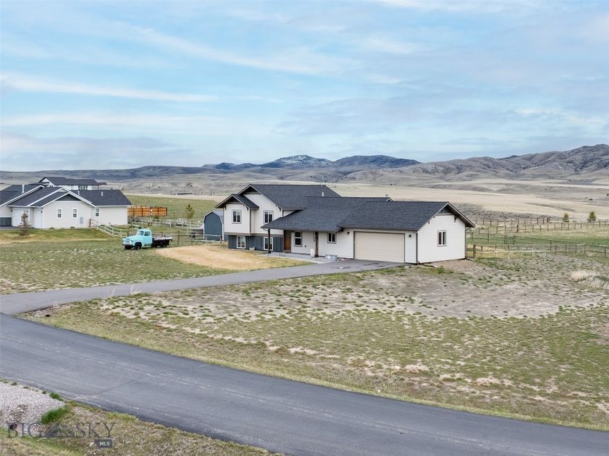 Located in Wheatland Meadows in Three Forks, this well kept tri-level home offers space, function, and wide open Montana views. Built in 2020 on 1.98± acres, the property features 2,650± square feet with 4 bedrooms and 3 bathrooms, designed for comfortable everyday living with room to spread out. The main level includes the kitchen, entry, mudroom, and living area centered around a gas fireplace. Upstairs, the primary suite is joined by two additional bedrooms and a full bath. The lower level adds flexible living space, a fourth bedroom, full bath, and laundry room.  Step outside to a large fenced backyard with an additional fenced garden area, covered front patio, and back patio, all positioned to take in the mountain views and open skies. Enjoy a balance of privacy and convenience with easy access to Copper City Trails, downtown Three Forks, and a quick 25 minute drive to Bozeman and Bozeman Yellowstone International Airport. A strong option for those wanting newer construction, usable land, and the Montana lifestyle without giving up accessibility. Please note, the home has known foundation issues. Disclosures outlining recommended repairs are available, and the property is being sold as-is. The pricing reflects the work needed to bring the foundation up to standard. With its thoughtful layout, quality finishes, and sweeping views, this property presents a compelling opportunity.
