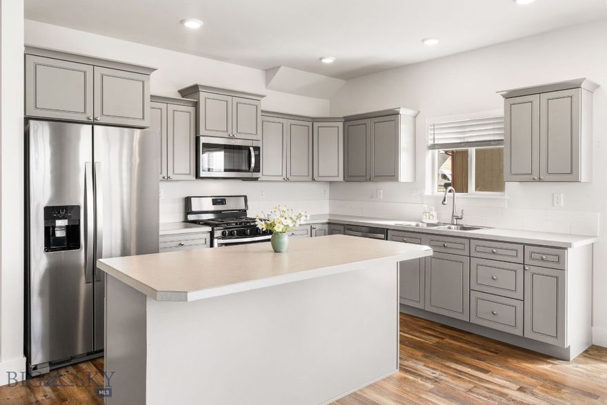 This comfortable townhome has lots of natural light from south facing windows and sits next to subdivision open space. Well-appointed kitchen includes large center island, tile backsplash and stainless-steel appliance package. The living room, dining room and kitchen join to promote an enjoyable atmosphere for gathering friends and family. Sliding door access from dining to extended concrete patio is perfect for grilling.  A vaulted ceiling in the master enhances the spacious feel. Two additional bedrooms are generous in size. Extra space upstairs is a convenient office/workspace. Upgrades include full window treatment package including blackout in bedrooms, central a/c, ceiling fans, glass shower doors and luxury vinyl flooring throughout the main level. Double attached garage offers ample storage space. This is an end unit.